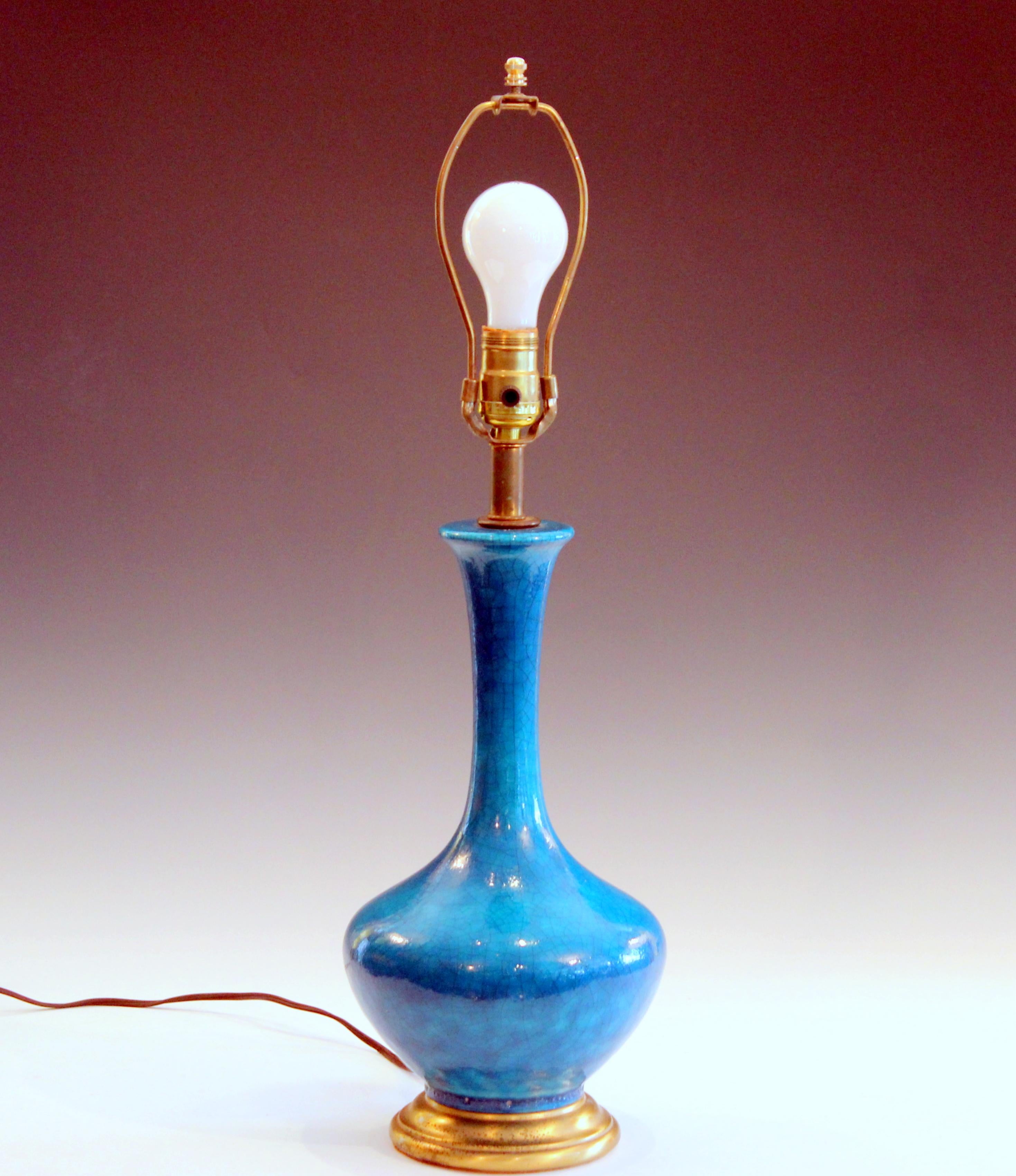 Vintage turquoise crackle glaze lamp in sensuous genie bottle form with heavy crackle glaze, circa 1960s. Measures: 25