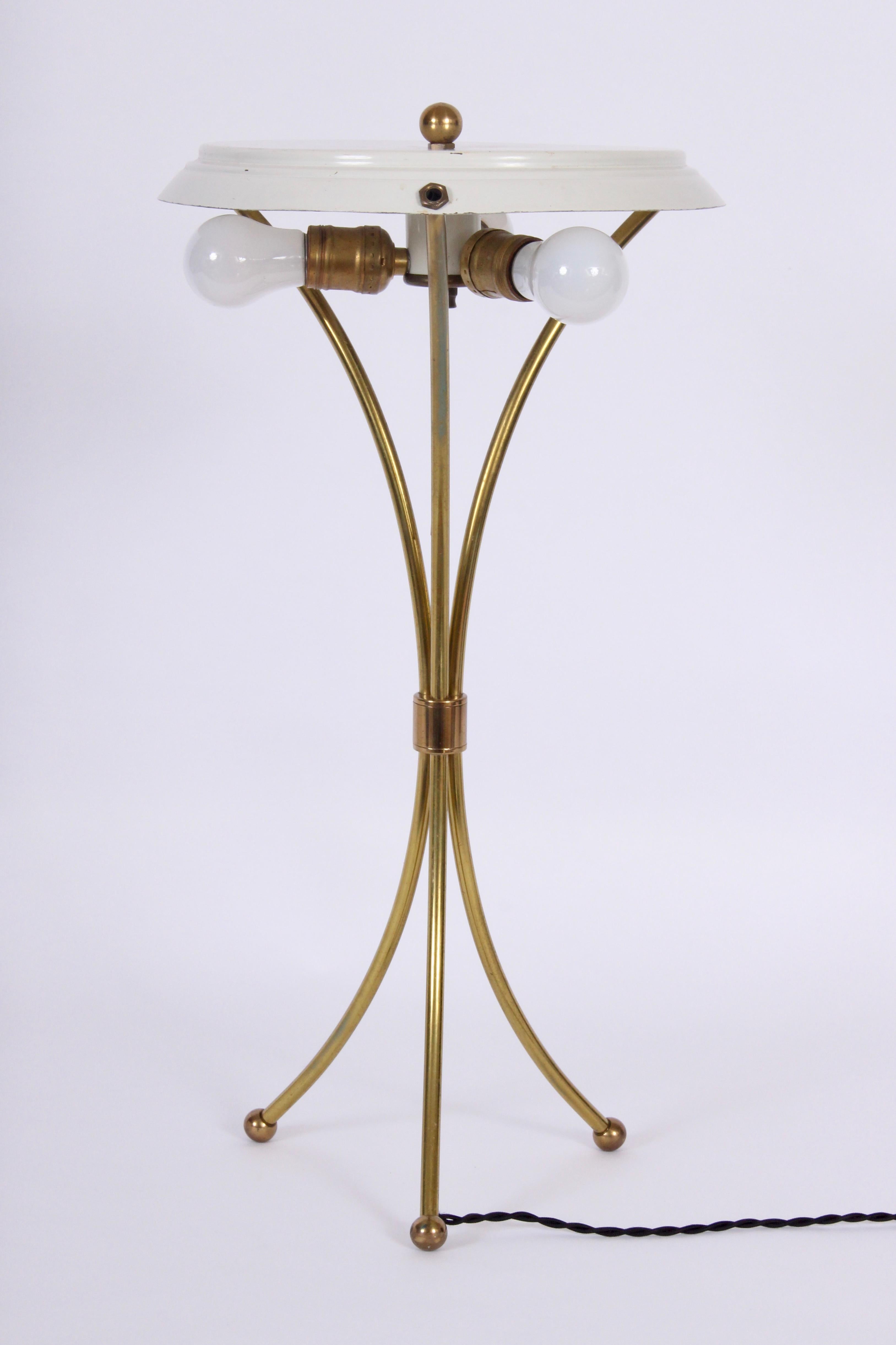 Gerald Thurston arched and clasped brass tripod desk lamp, bedside lamp. Original lamp frame with new white linen. Shade measures (6 H x 12 D top x 14 D bottom). Base 8D. Triple sockets. Pull chain. Up to 60 watts per socket, late 1940s-1950s.