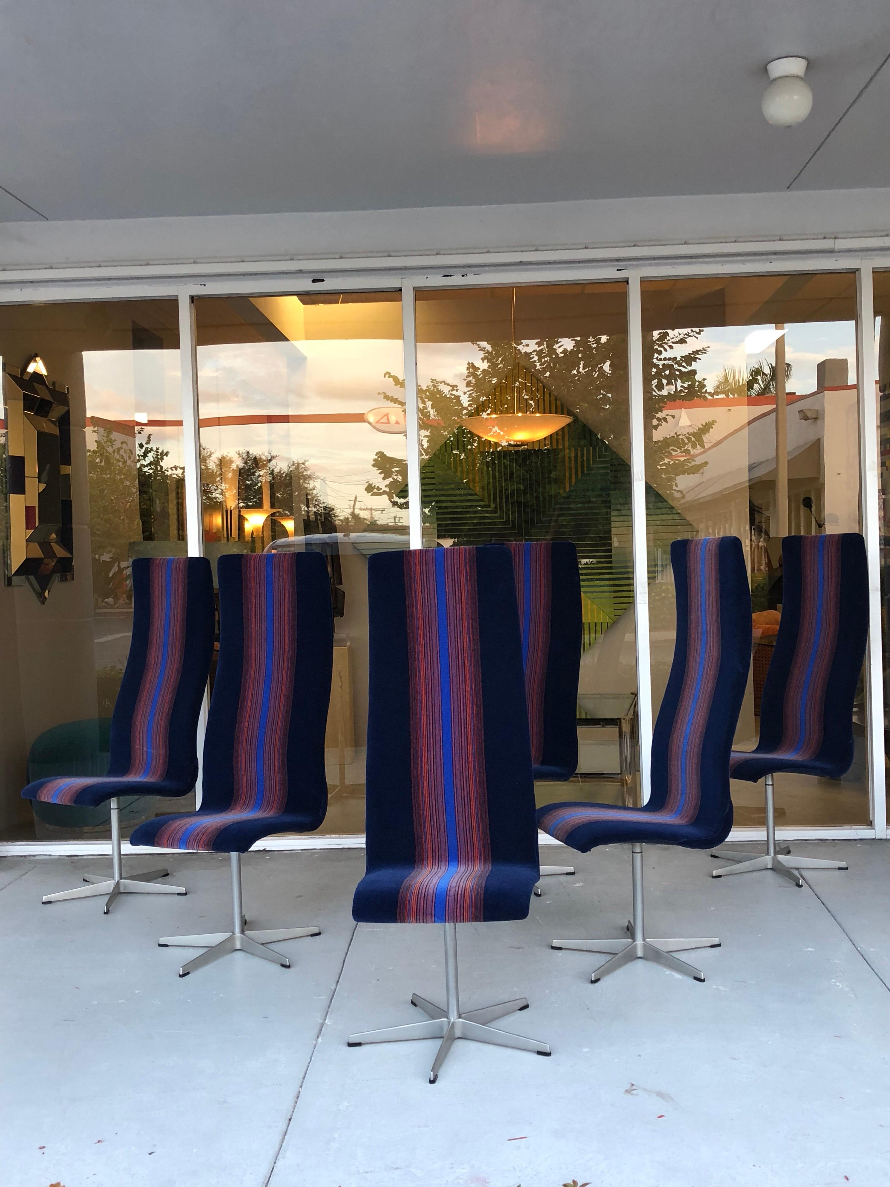 A set of six Oxford chairs. A seemingly simple design becomes the epitome of modern elegance in the hands of Arne Jacobsen. The upholstery is blue and orange mohair, possibly a fabric design by Verner Panton.