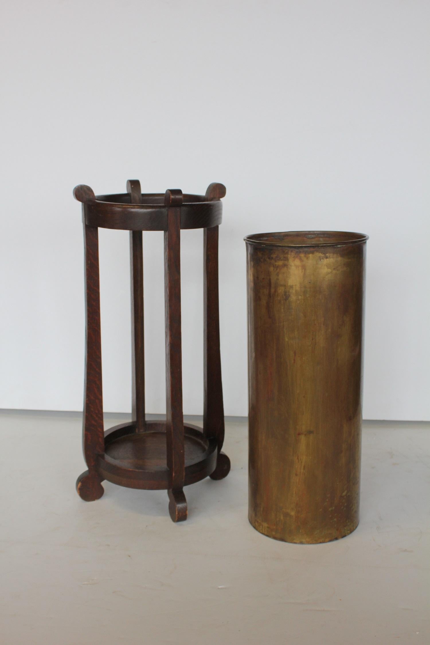 Mission oak and brass umbrella stand by The Lakeside Craft Shops. It has stamp on the bottom.