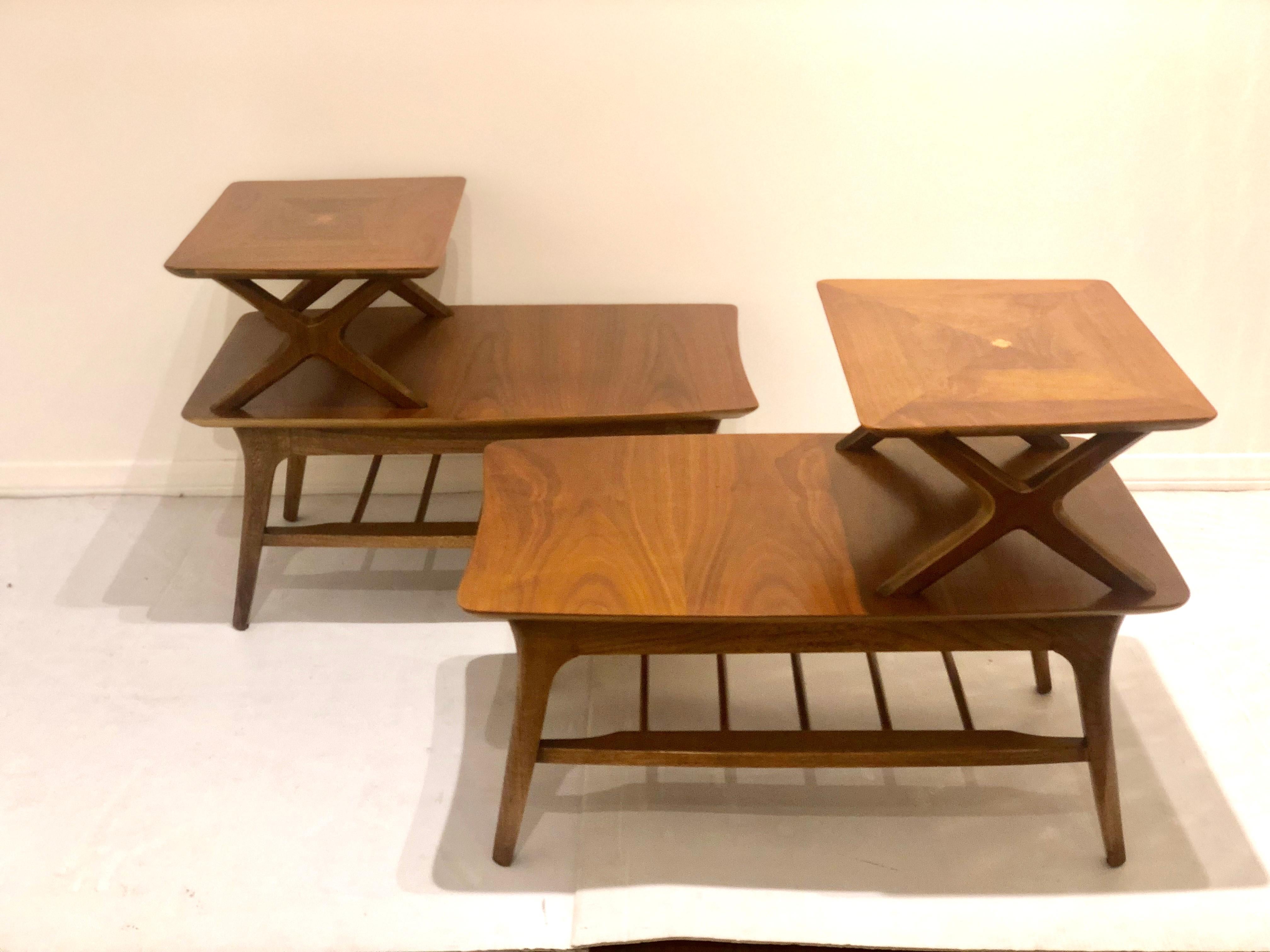 Great pair of walnut step end tables with magazine rack shelf, freshly refinished great lines and beautiful mix veneer, Classic Atomic Age design.