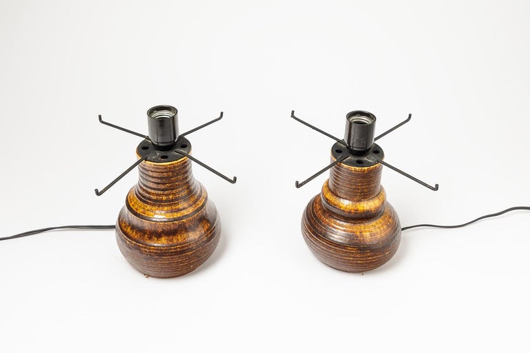 Elegant pair of ceramics lamp by Accolay

Accolay was a famous ceramic fabric in france

Beautiful brown stoneware glaze.

Really elegant because there is a small difference between the two forms.

Dimensions without electric part: High 19