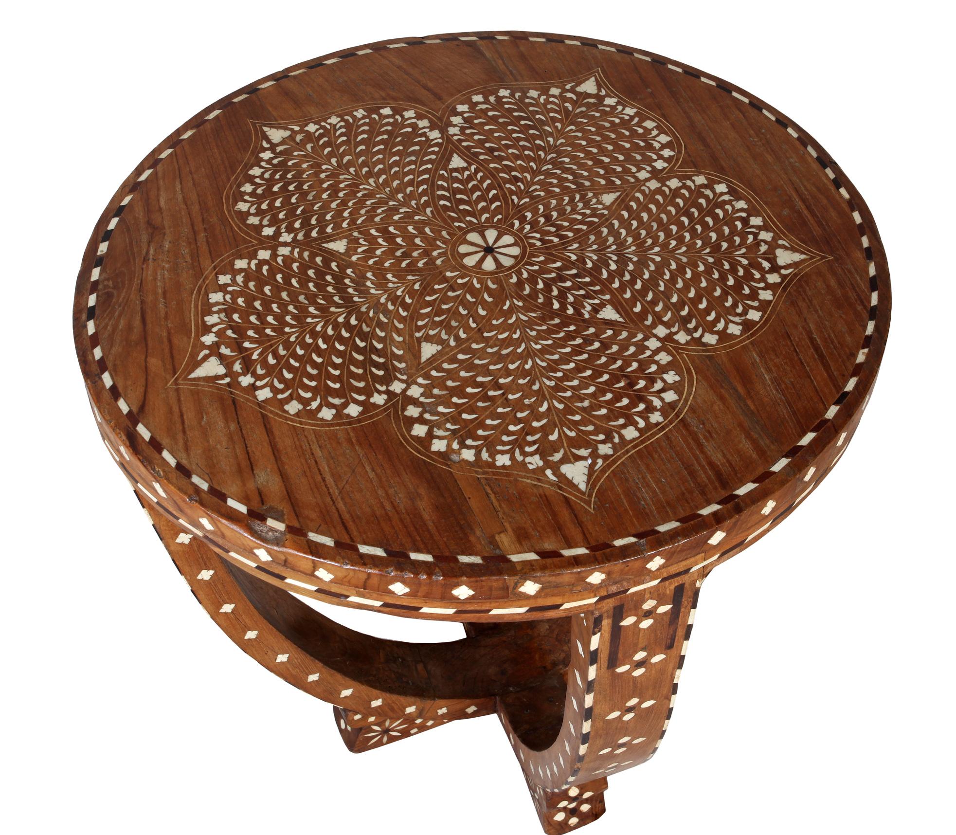 Teak center or side table with incredibly intricate bone and rosewood inlay. U-Shaped base. Flower petal motif on tabletop. Mid-1900s, India.