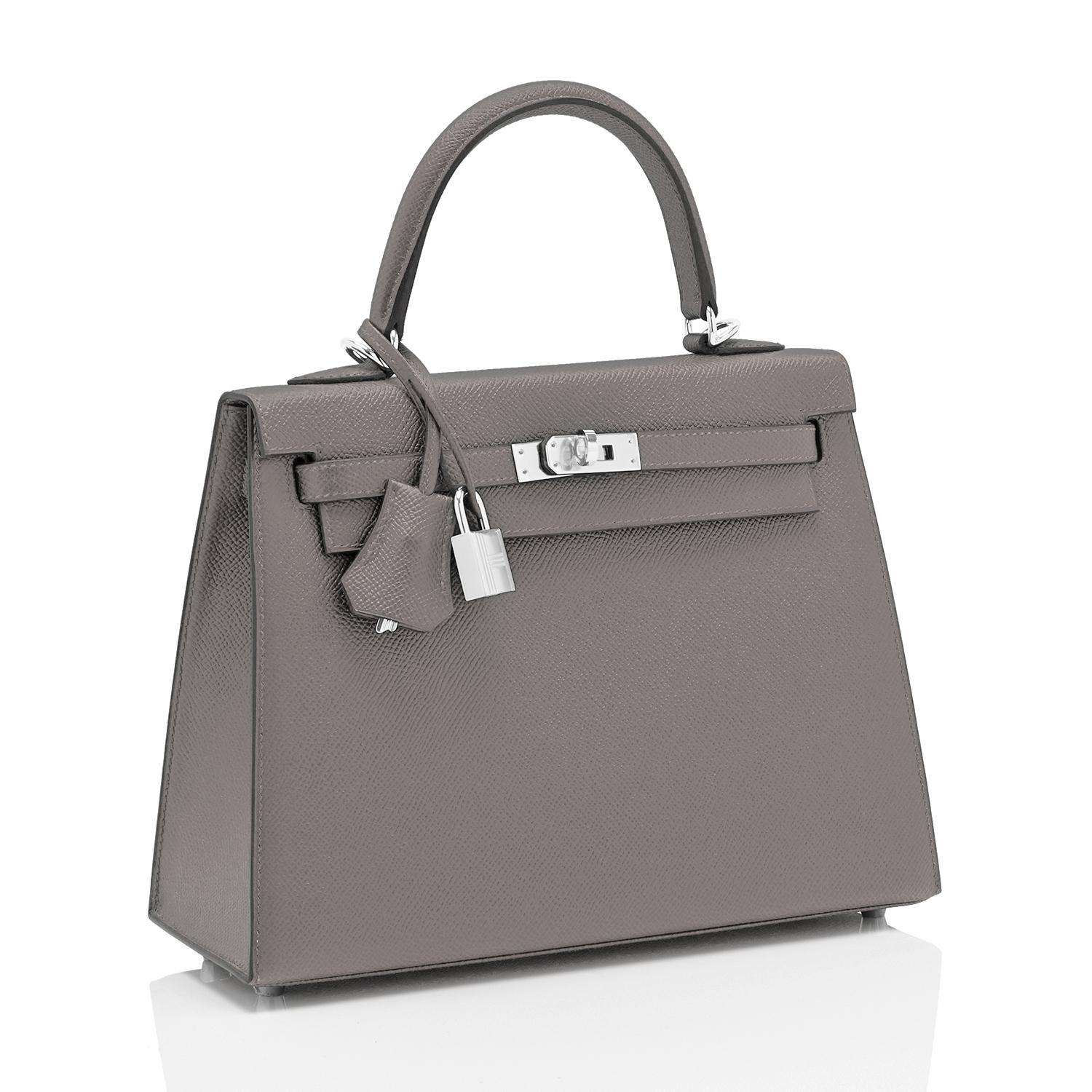 Hermes Kelly 25 Etain Sellier Shoulder Bag Tin Grey Z Stamp, 2021
The ultimate modern chic 25cm Kelly in the best neutral ever!
Brand New in Box. Store Fresh. Pristine Condition (with plastic on hardware).
Perfect gift! Comes full set with keys,