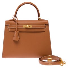 Hermès Kelly 25 Handtasche aus goldenem Leder mit beigen Griffen, 2026