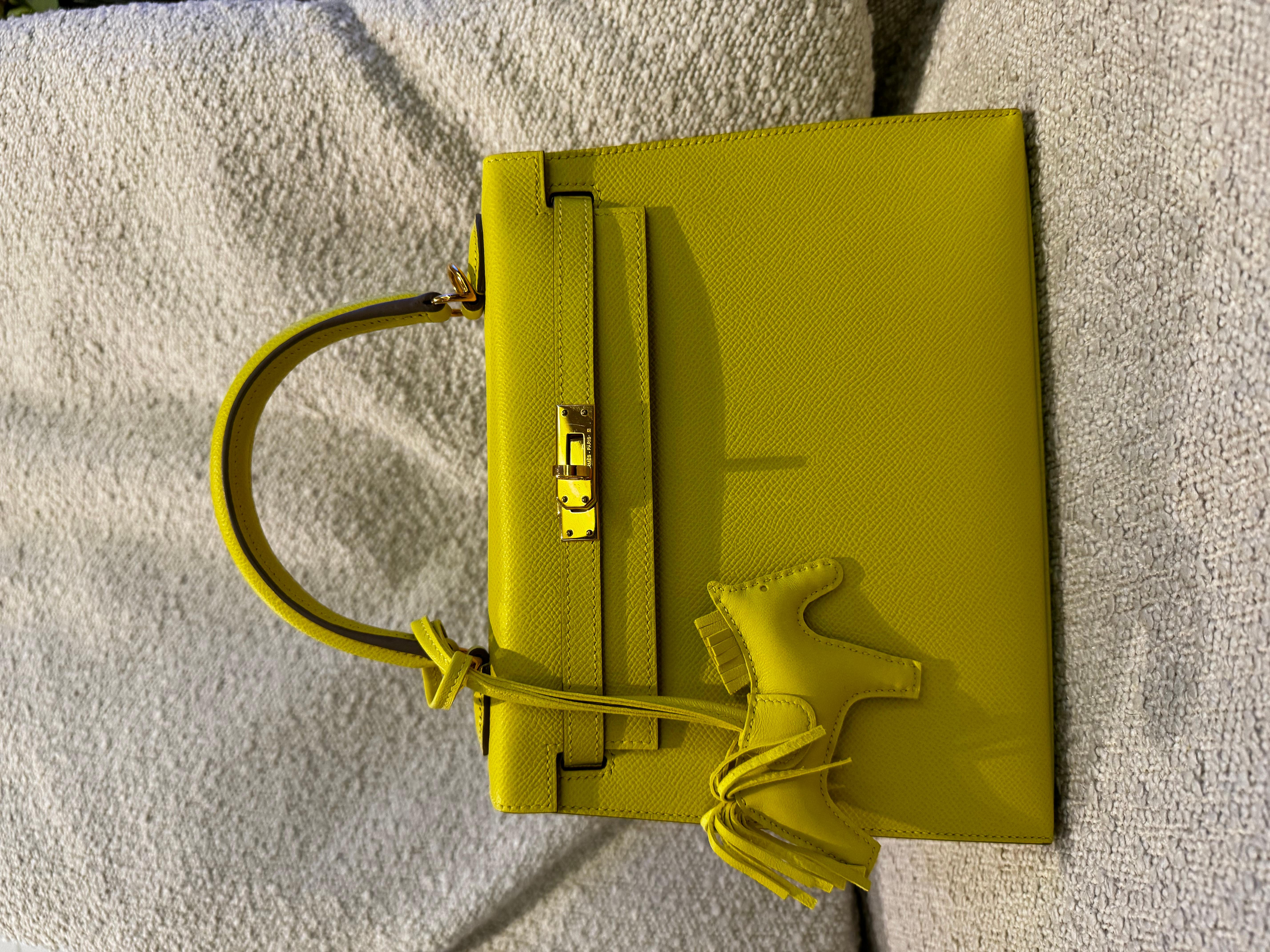 Hermes Kelly 25 Crafted from high-quality Epsom leather, in a  vibrant lime color with gold hardware.The epsom leather is known for its durability and scratch-resistant properties, ensuring that your bag maintains its pristine condition for years to