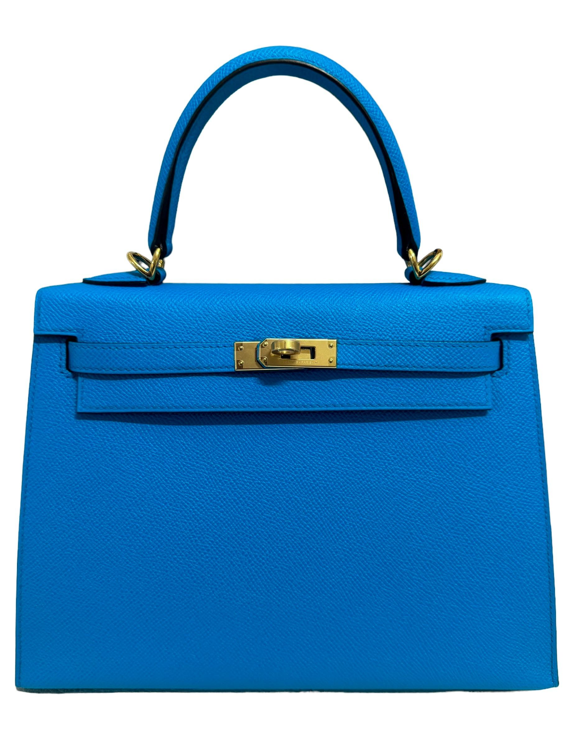 As New VERY RARE Most Coveted Hermes Kelly 25 Blue Frida Epsom Leather. Complimented by Gold Hardware. As New with Plastic on all Hardware and feet. 2020 Y Stamp. Includes all accessories and Box.

Shop with confidence from Lux Addicts. Authenticity