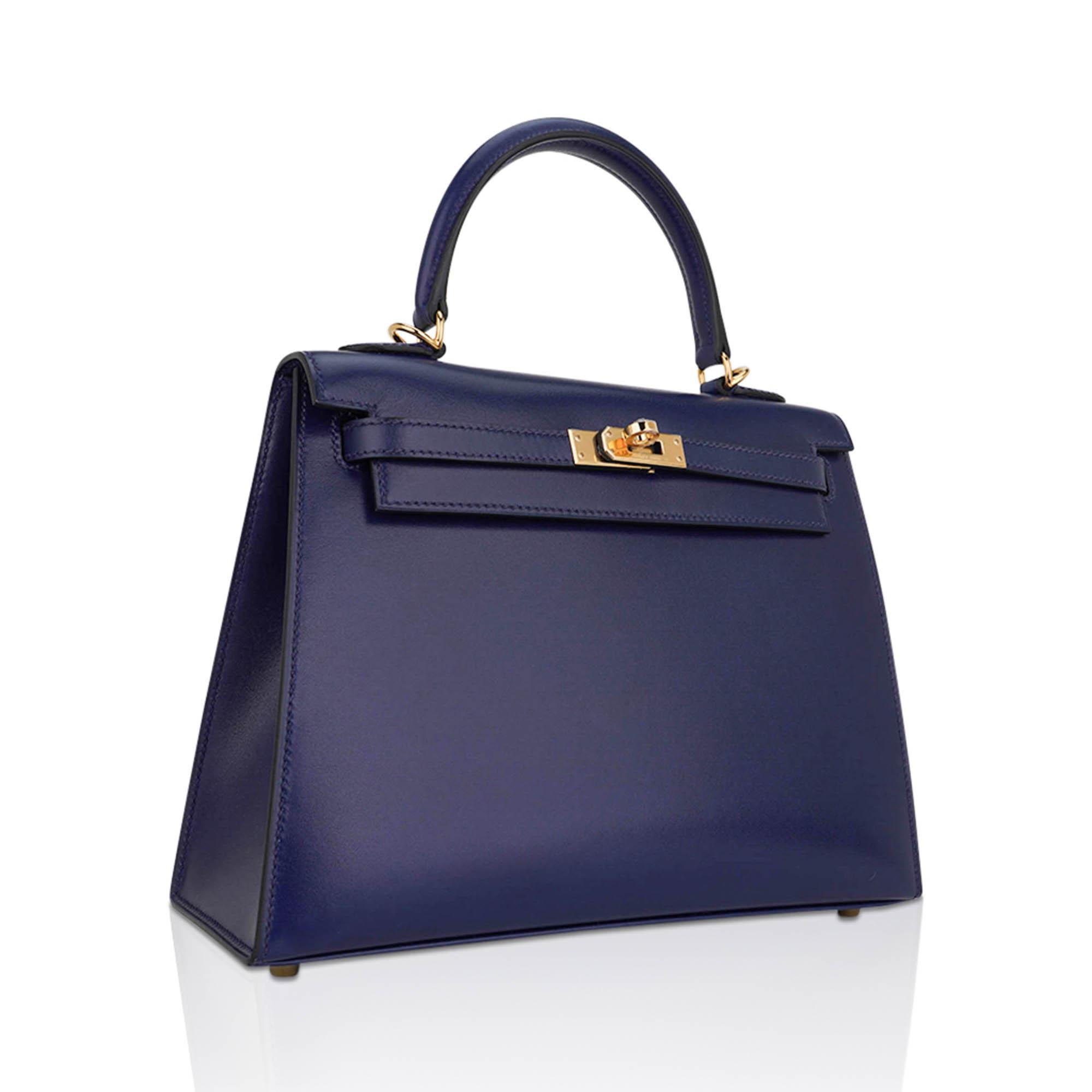 Mightychic offers an Hermes Kelly Sellier 25 bag featured in jewel toned Blue Sapphire Box leather.
Considered to be of the most collectible heritage leathers from Hermes, this timeless beauty exudes chic style.
Bleu Saphir is saturated and can
