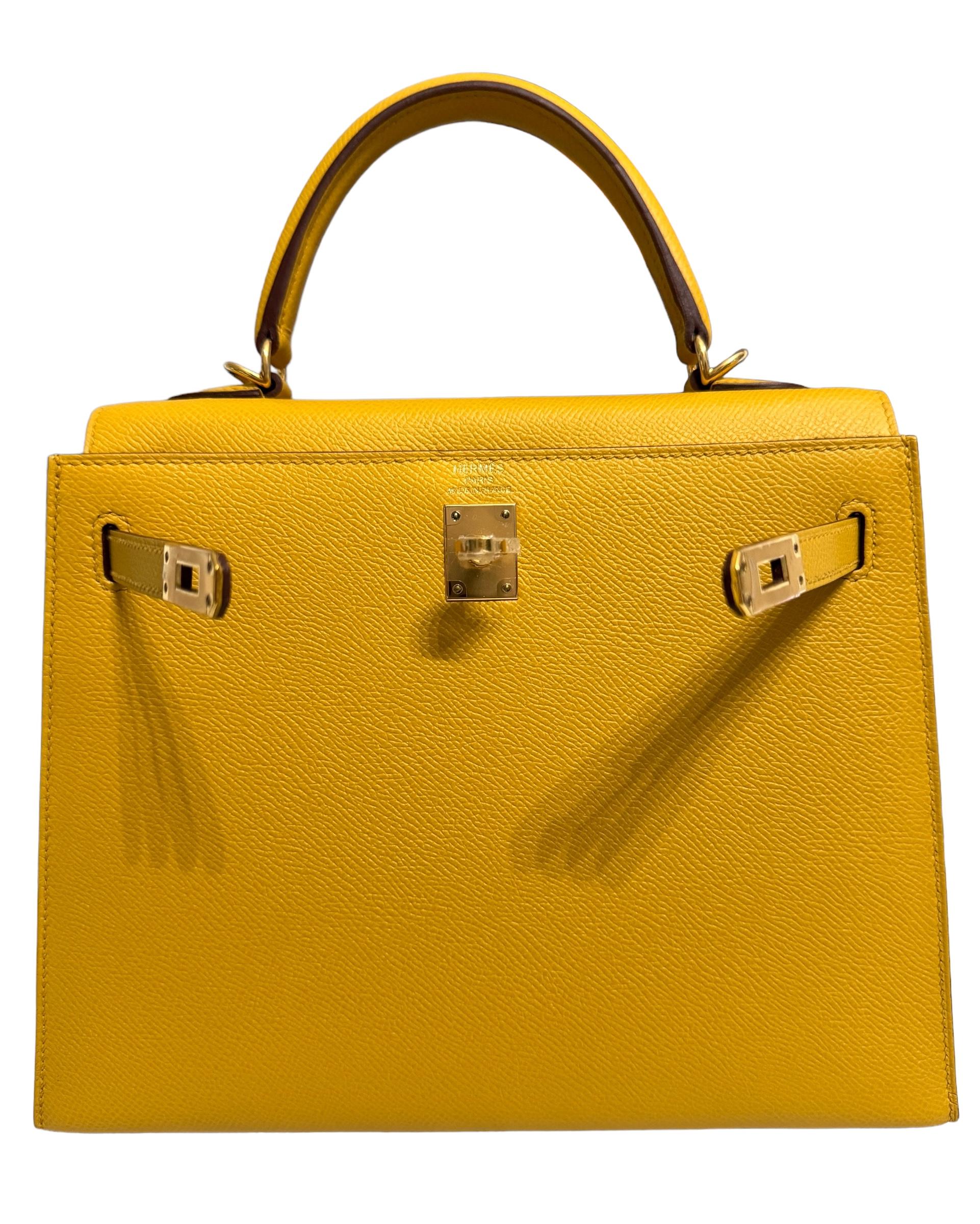 AS NEW RARE MOST WANTED Hermes Kelly 25 Sellier Jaune Ambre Epsom Leather. Complimented by Gold Hardware. As New with Plastic on all Hardware and feet. 2020 Y Stamp. Includes all accessories and Box.

Shop with Confidence from Lux. Addicts.