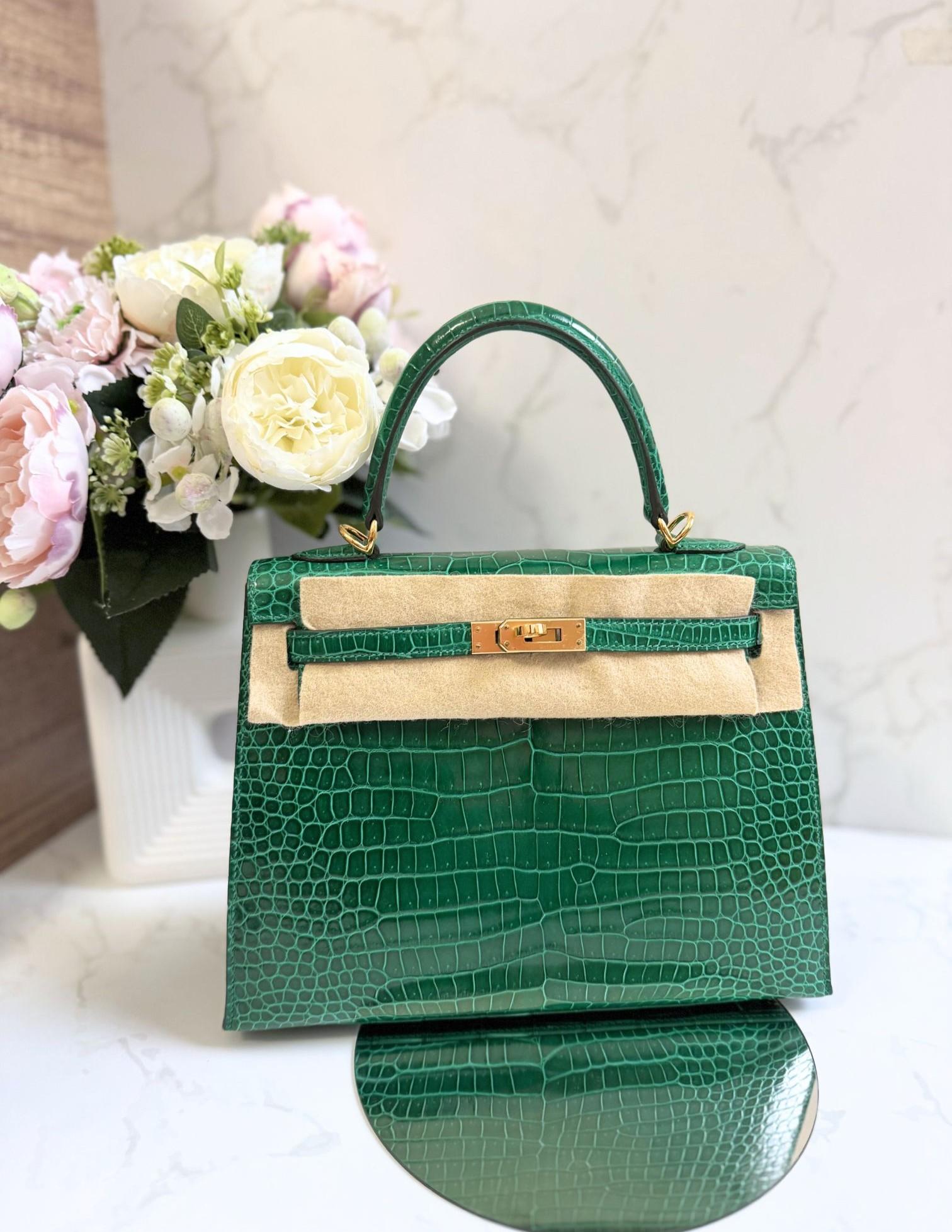 The Hermes Kelly 25 in vert emeraude with shiny porosus leather and gold hardware is a stunning choice! The vibrant emerald green adds a luxurious pop of color, while the porosus crocodile leather gives it a unique texture and shine. The 25 cm size