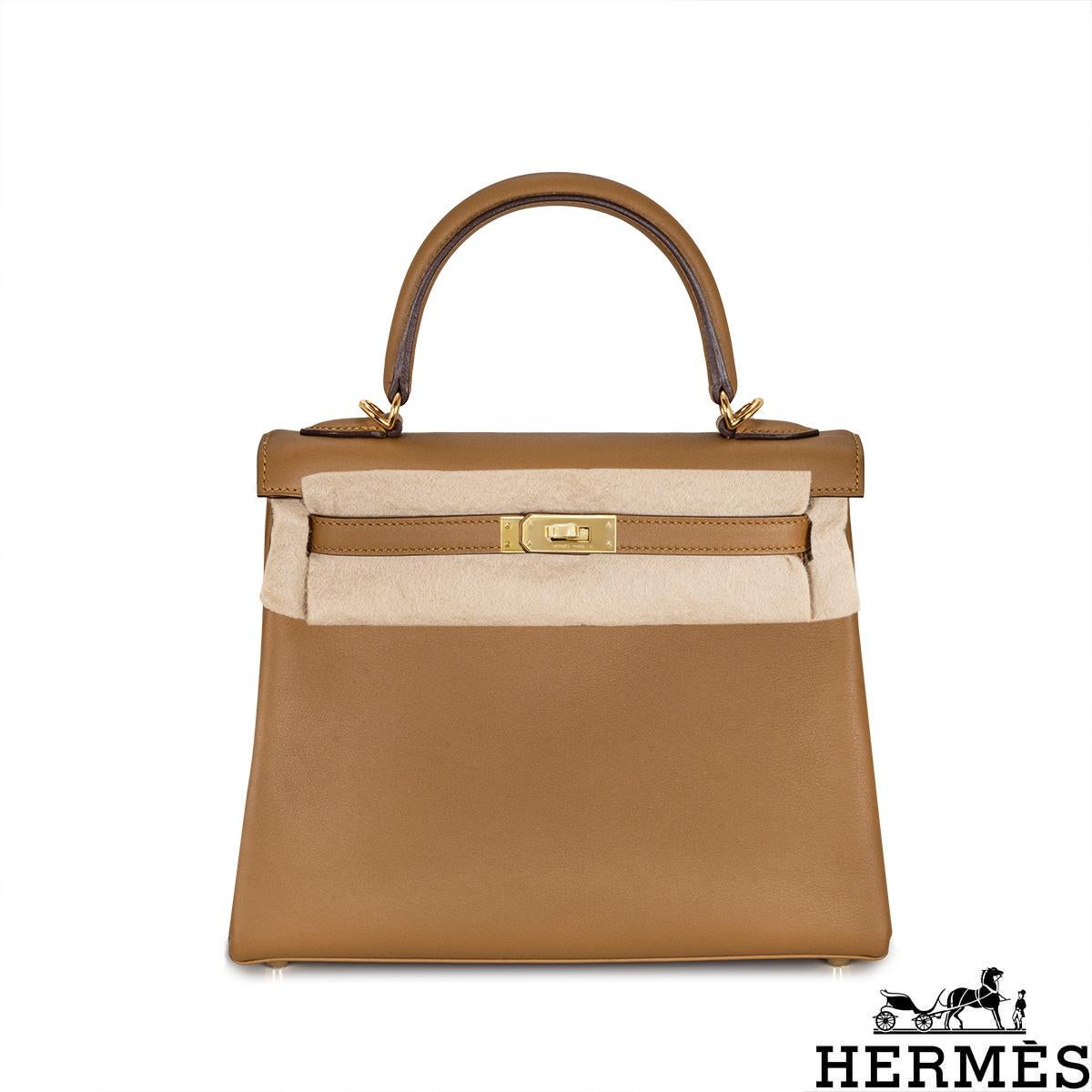 A lovely Hermès 25cm Kelly bag. The exterior of this Kelly is crafted in Bronze Dore Swift leather, is complemented with gold-tone hardware and tonal stitching. It features a front toggle closure with two straps, a single rolled handle and a
