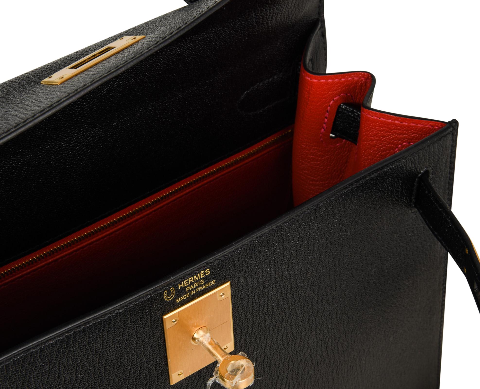 Guaranteed authentic rare chevre leather HSS Hermes Kelly 28 sellier bag with brushed gold hardware.
Black with Vermillion red  interior brings drama.
Exquisite handbag.
Comes with lock, keys, strap, clochette, sleepers, raincoat and signature