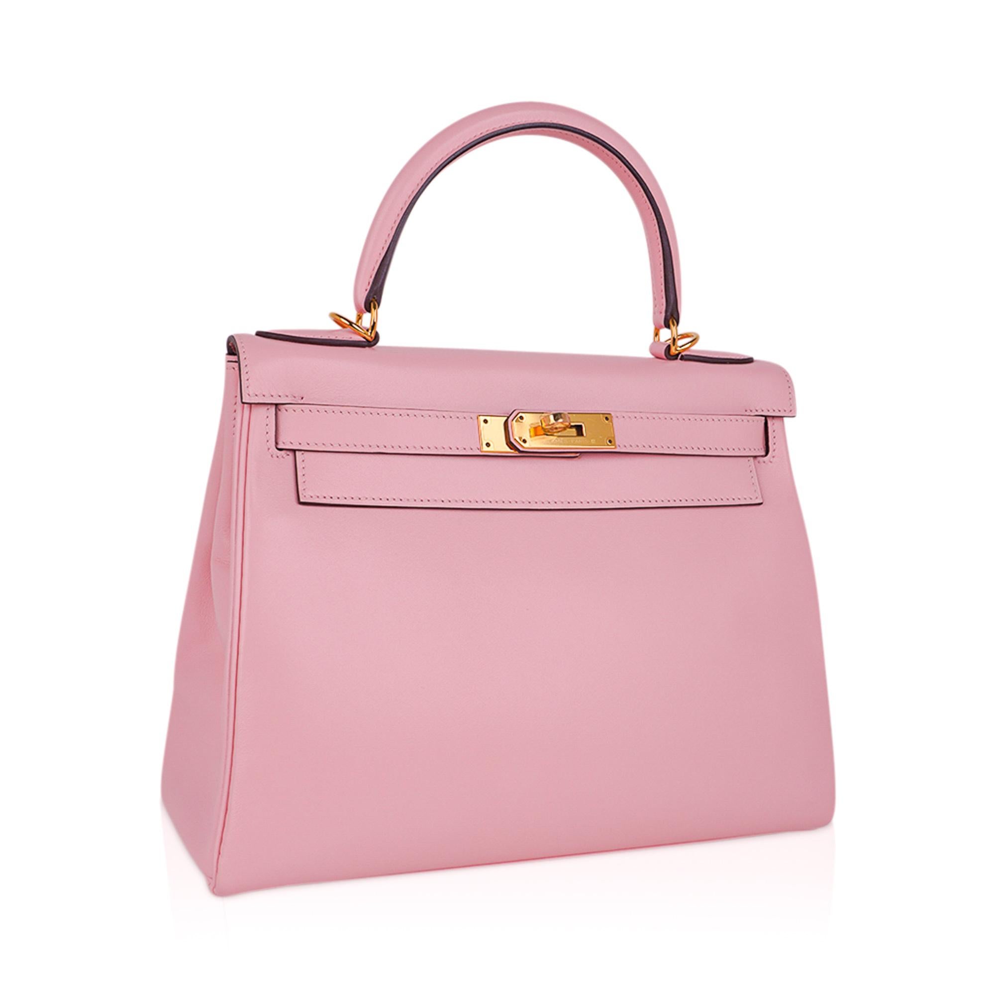 Mightychic offers an Hermes Kelly 28 bag featured in coveted Rose Sakura.
This exquisite Hermes bag is simply one of the beautiful colours ever produced!
Gorgeous Cherry Blossom pink in swift leather.
Even more rare to find with gold hardware.
This