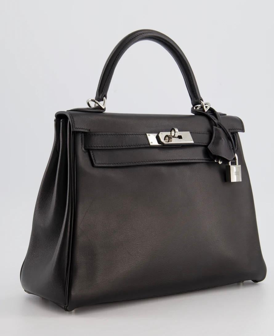 Hermes Kelly 28cm Retourne in Black Swift Leather with Palladium Hardware

This bag is in excellent condition with minor signs of wear to the leather and hardware, with some seals on the hardware
Please see all of the photos for more information on