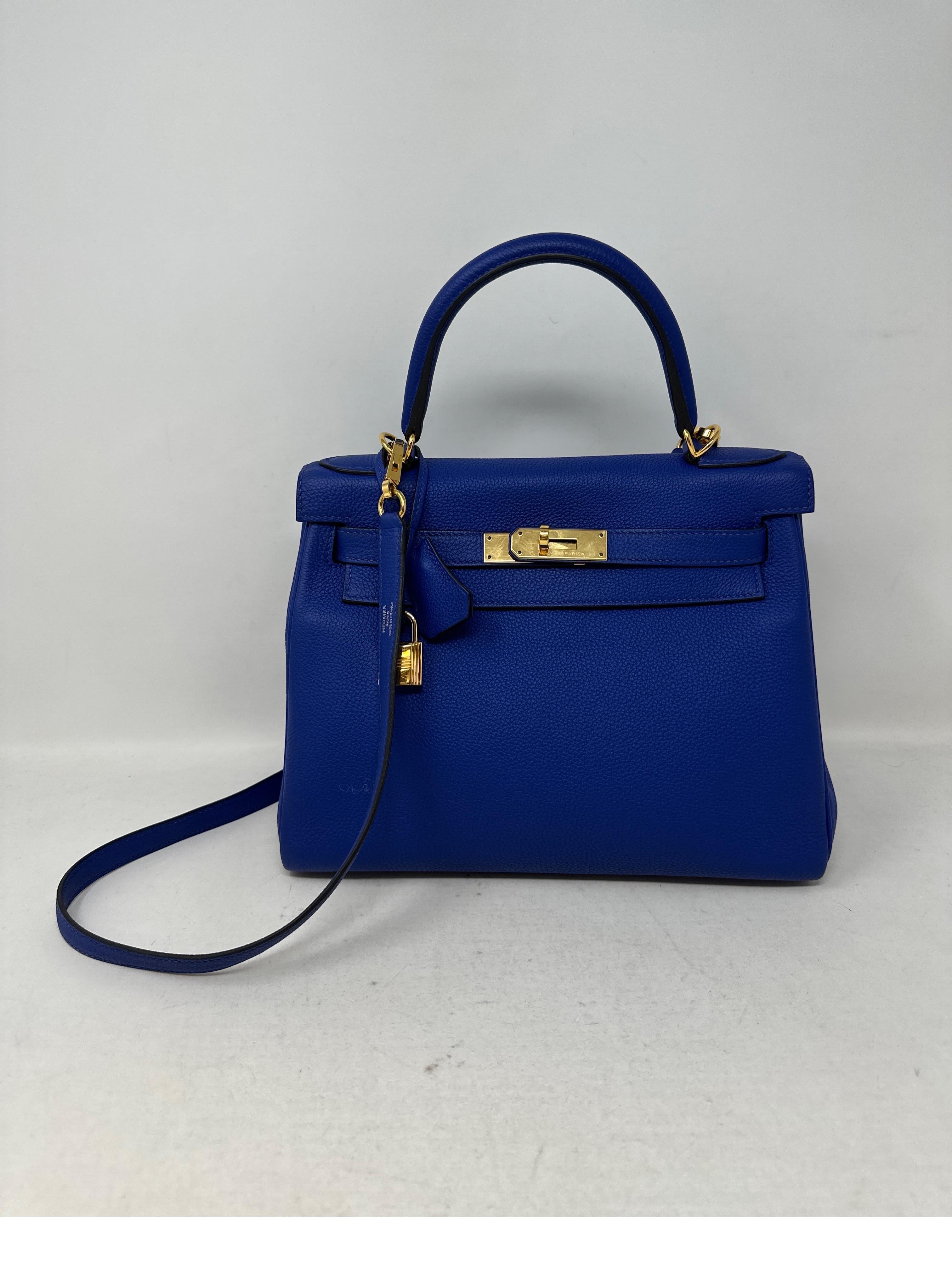Hermes Kelly 28 Bleu Electric Bag. Togo leather in most wanted blue color. Gold hardware. R stamp. Rare combination and most desired Kelly size 28. Demand for small Kelly bags are going up. Includes clochette, lock, keys, and dust bag. Guaranteed