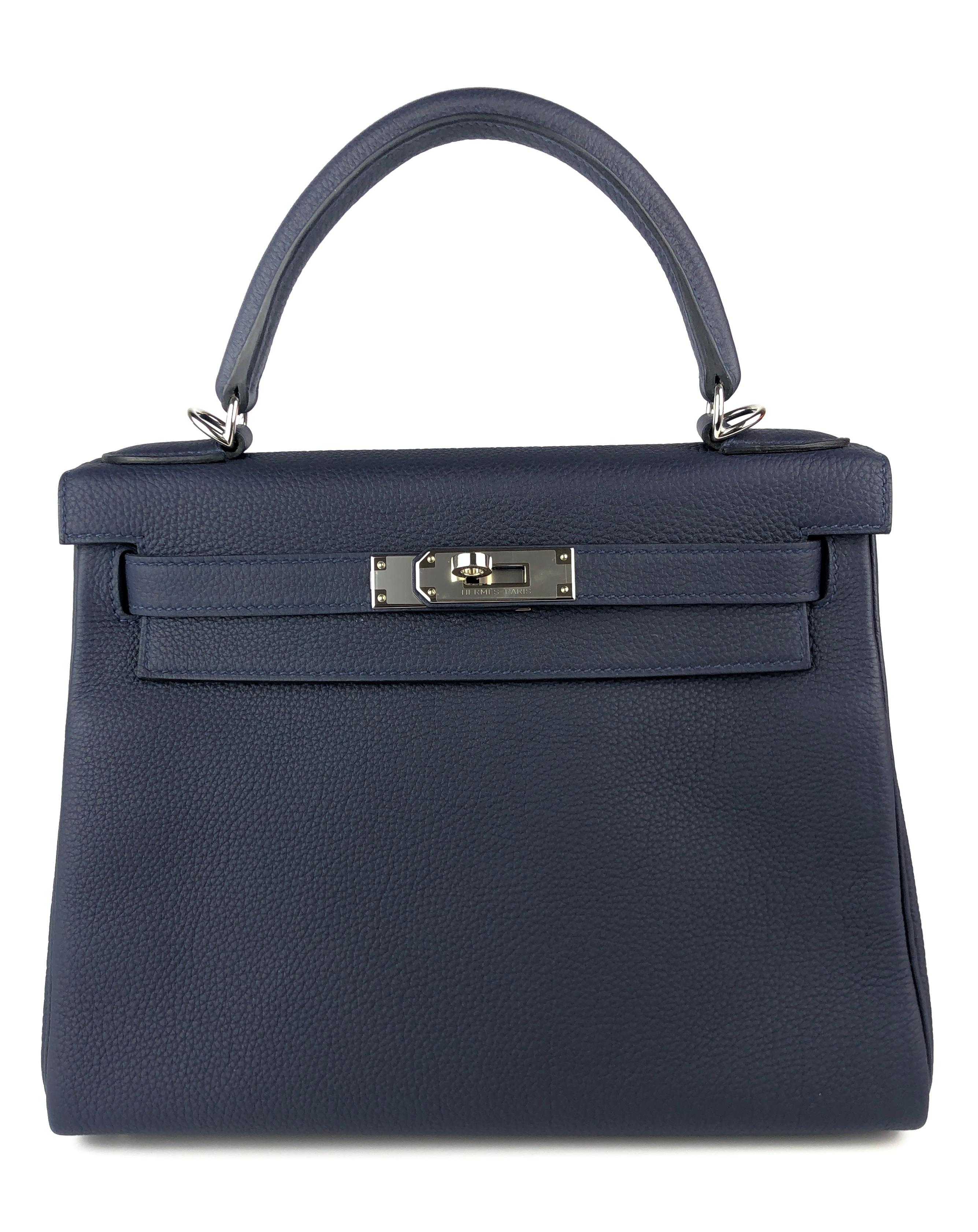 Rare Stunning Hermes Kelly 28 Bleu Nuit Togo Leather Complimented by Palladium Hardware. Excellent Condition with plastic on Hardware and feet! D Stamp 2019.

Please keep in mind that this is a pre owned item, the bag has been carried before, unless