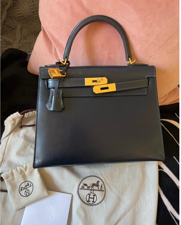  Hermes Kelly 28 box leather in bleu marine colour with gold hardware. Very rare, not produced anymore in this leather and color combo. Recently repaired by Hermes with brand new hardware, handle, clochette, lock and keys (all with plastic on).
