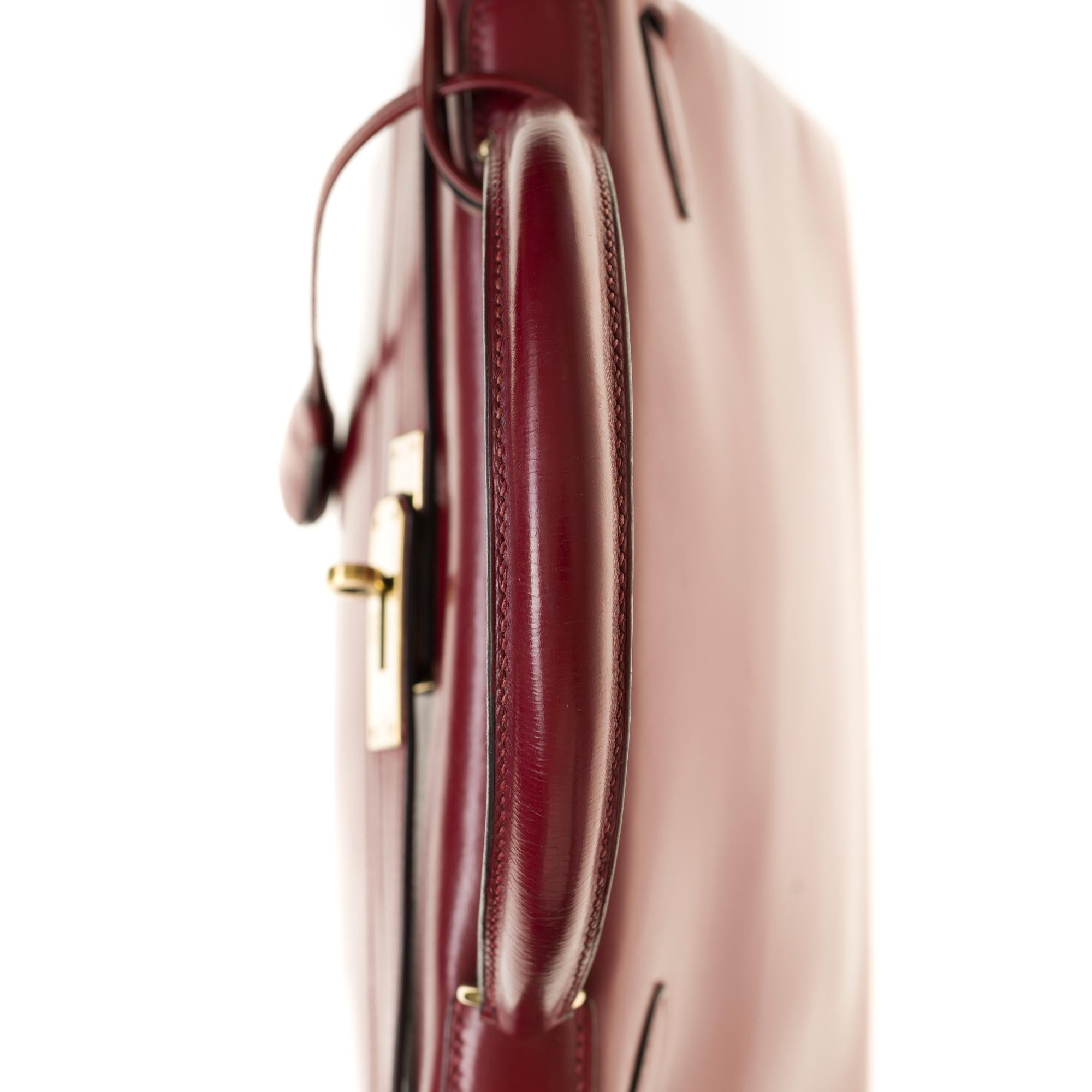Women's Hermes Kelly 28 cm strap in Burgundy box calf shoulder bag with gold hardware