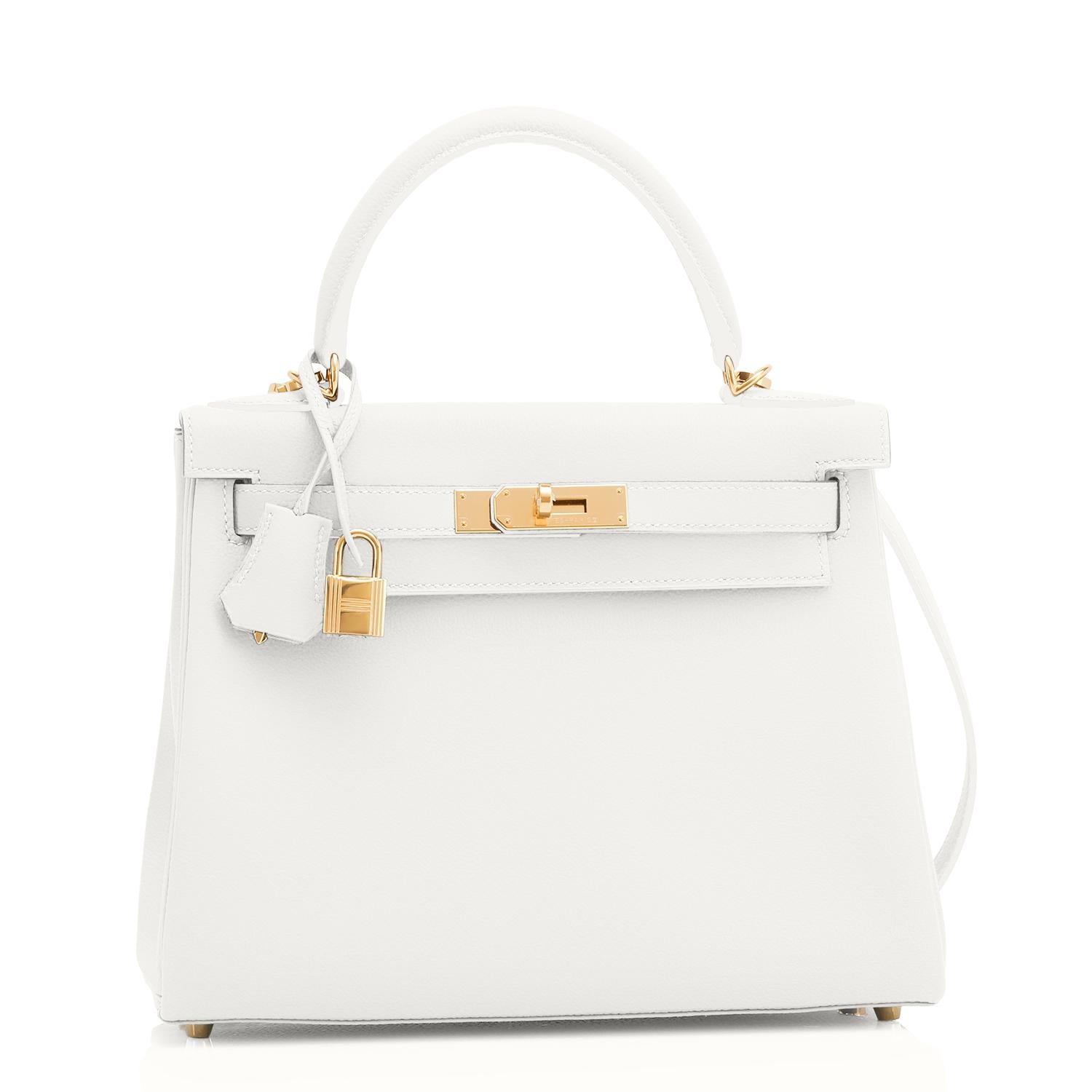 Guaranteed Authentic Hermes Kelly 28 Horseshoe Stamp White and Gris Asphalte Kelly VIP Y Stamp, 2020
Uber chic! World Exclusive! A spectacular bicolor combination custom made for a VIP.
Just purchased at Hermes store; bag bears new interior 2020 Y