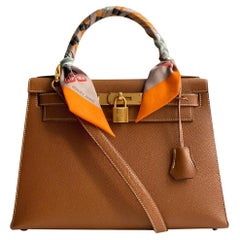 HERMÈS:: Kelly 28 aus braunem Leder