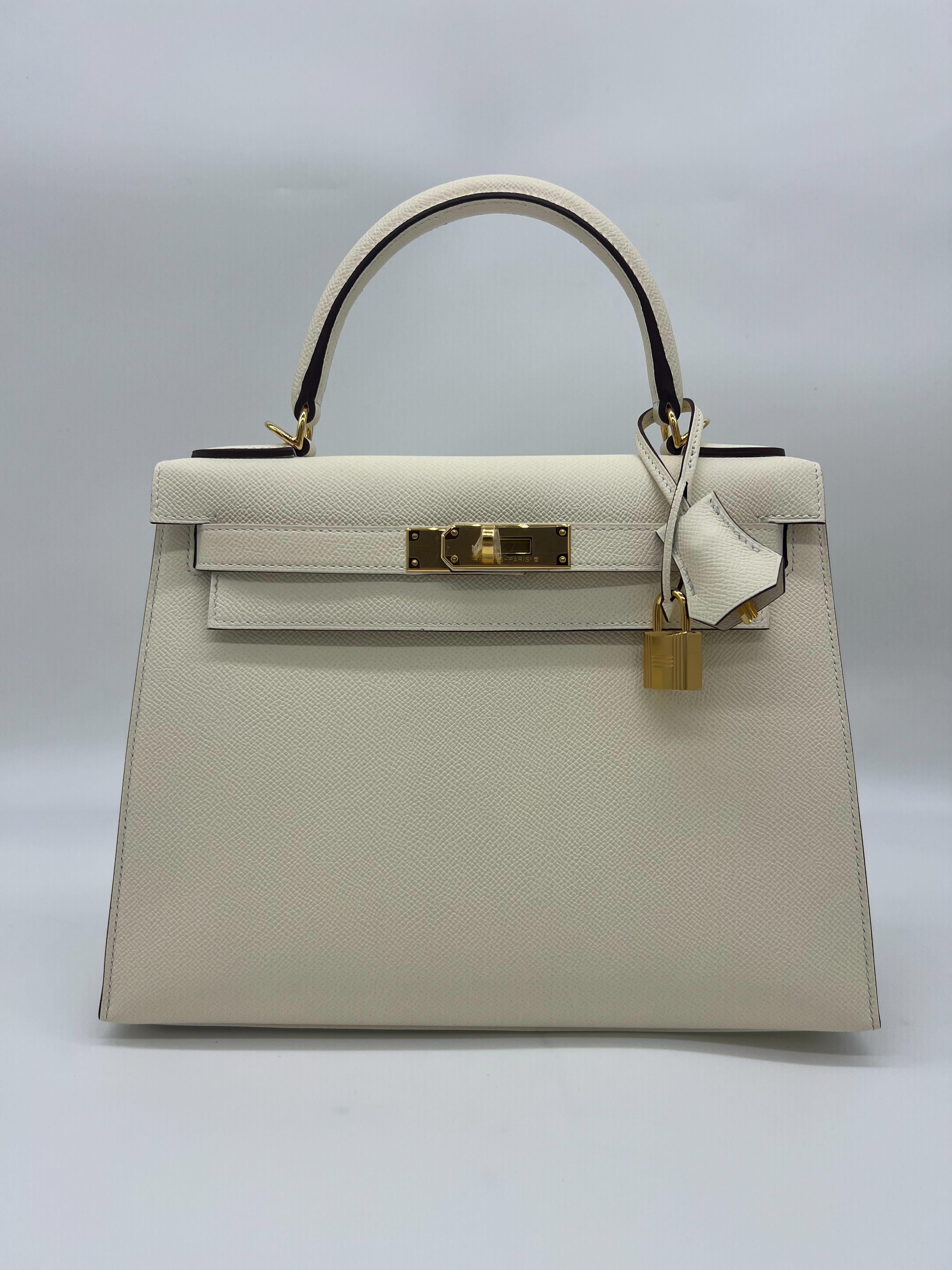 Hermes Kelly II Sellier 28 Nata Epsom Leather Gold Hardware

Condition: Brand New 
Measurements: (H) 22cm (W) 28cm (D) 11 cm
Material: Epsom Leather
Hardware: Gold Plated
 
Comes in full original packaging. 
Includes original Hermes raincover &