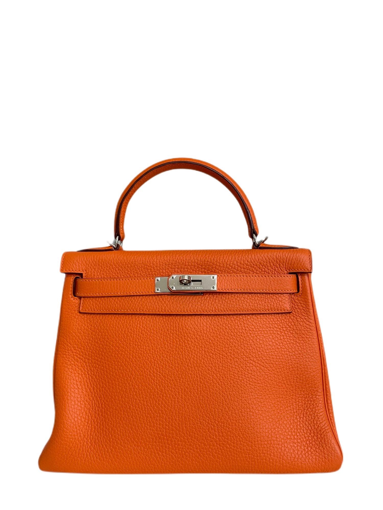 Hermes Kelly 28 Hermes Kelly 28 Orange Togo Leather Palladium Hardware. Pristine Condition, Plastic on hardware, Perfect corners and structure. 

Shop with confidence from Lux Addicts. Authenticity guaranteed! 
