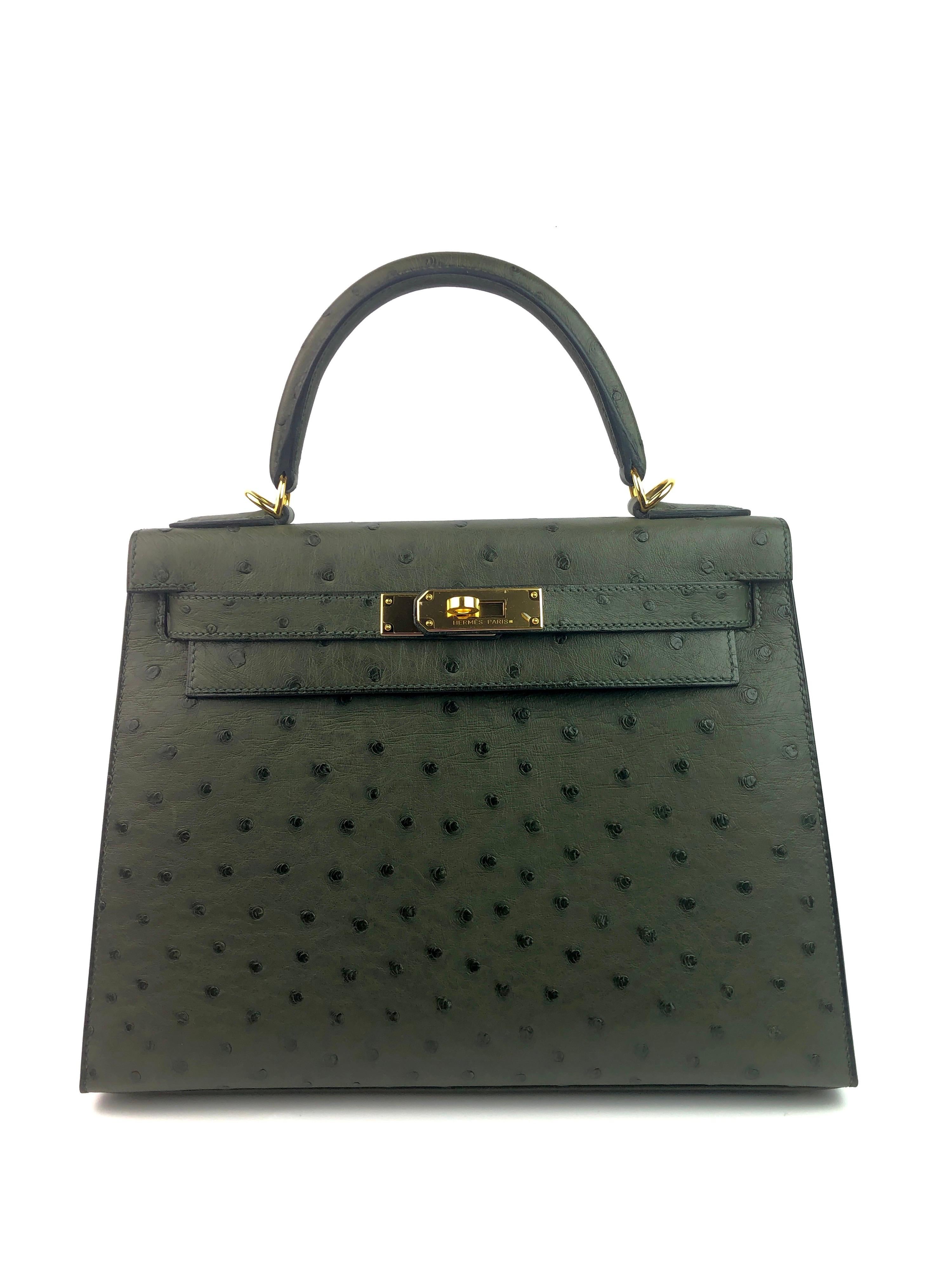 Hermes Kelly 28 Vert Veronese Green Gold Hardware With Plastic on Hardware. 2015 T STAMP. Almost Like New Condition, Plastic On Hardware and 2 feet, perfect corners and perfect structure. 

Shop with confidence from Lux Addicts. Authenticity