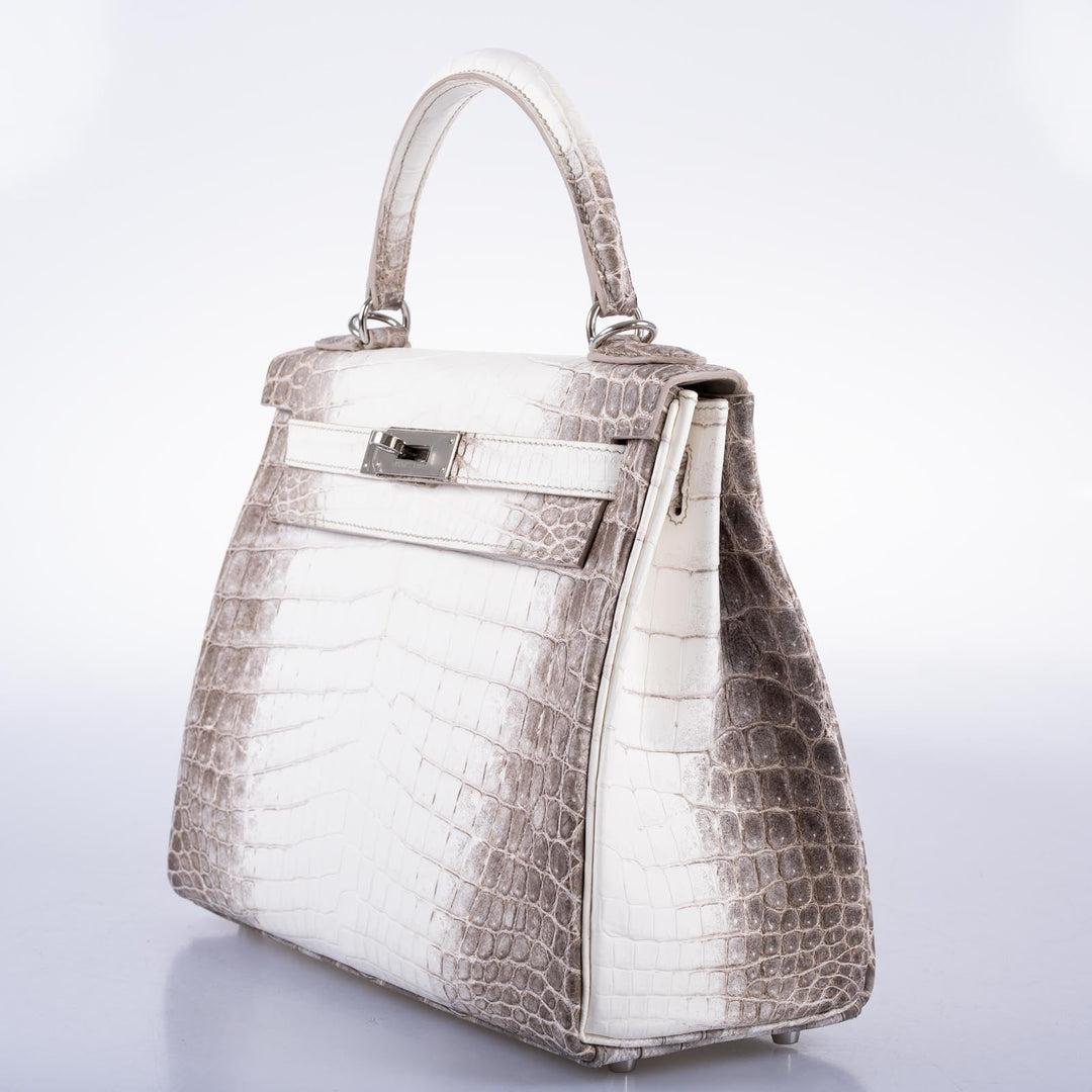 Hermès Kelly 28 Retourne Himalayan Niloticus Crocodile Palladium Hardware

The Hermes Himalayan is the world's most collectible bag for many reasons, but perhaps the most compelling is its unmatched combination of beauty and craftsmanship. The bag