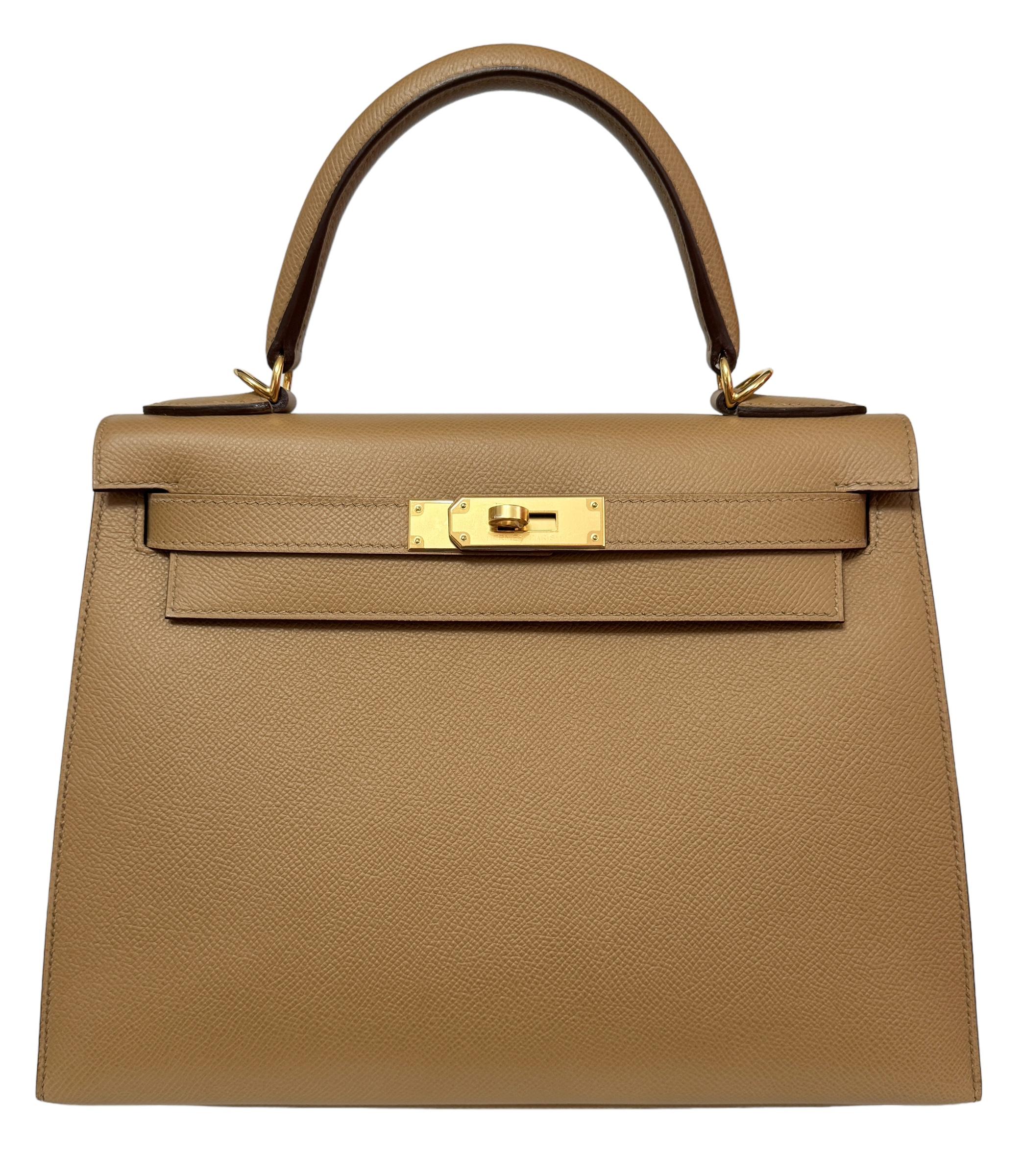 Absolutely Stunning Rare and Most Coveted As New Hermes Kelly 28 Sellier Biscuit Epsom Leather complimented by Gold Hardware. As New with Plastic on all hardware and feet. 2022 U Stamp. 

Shop with Confidence from Lux Addicts. Authenticity