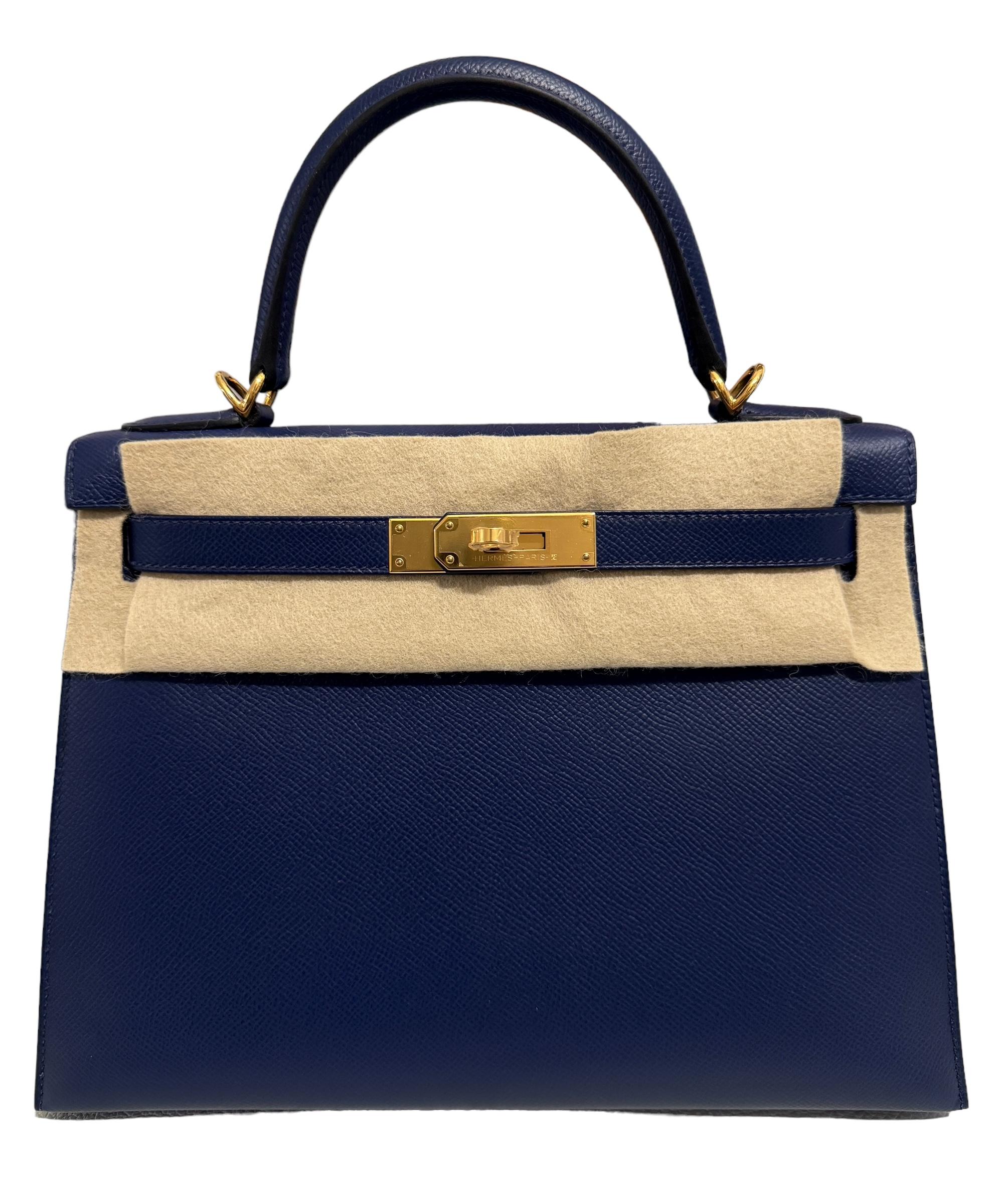 bsolutely Stunning Rare and Most Coveted color. As New Hermes Kelly 28 Sellier Blue Sapphire Epsom Leather complimented by Gold Hardware. As New with Plastic on all hardware and feet. 2021 Z Stamp. 

Please see last photo. Bag may have minor marks