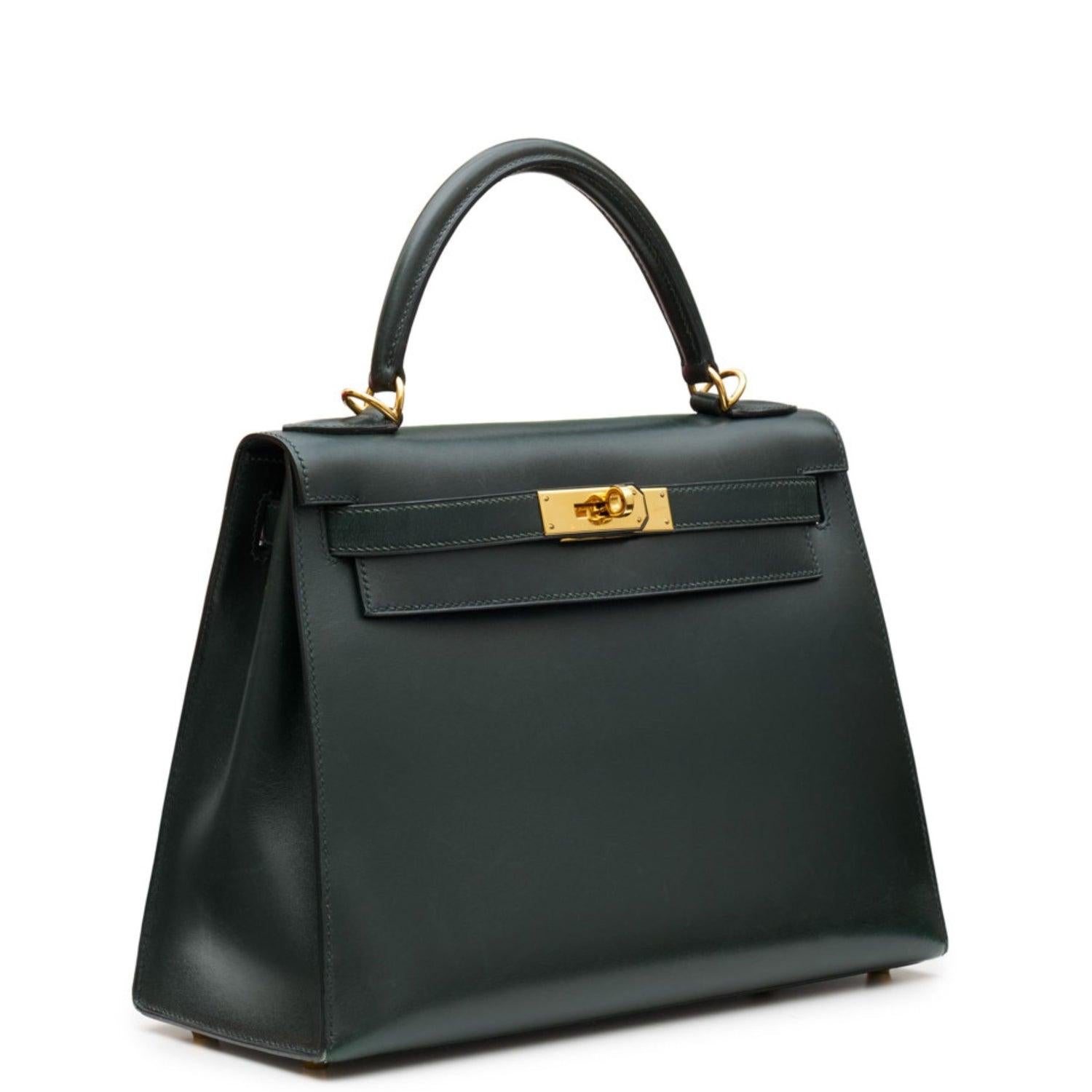 - Forest green
- Box leather
- Gold-tone hardware
- Single top handle
- Main compartment
- Internal zip-fastening pocket
- Internal patch pocket
- Detachable shoulder strap
- Comes with dust bag, padlock, key, and clochette
- Stamp D Square, Year