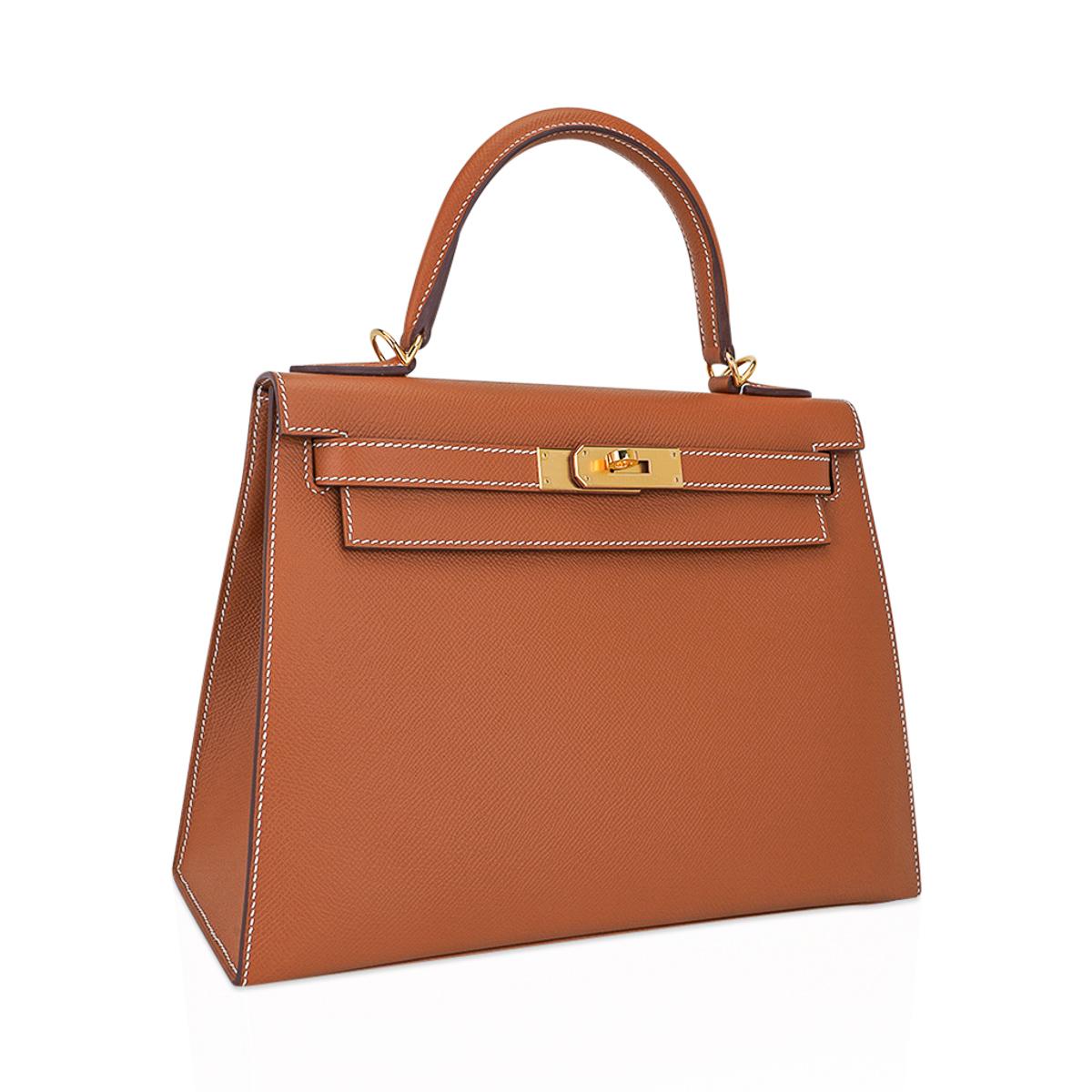 Mightychic offers an Hermes Kelly Sellier 28 featured in iconic Gold.
This classic epsom leather Hermes Kelly Sellier is perfect for year round wear.
Rich with Gold Hardware.
Divine size for day to evening.
Comes with signature Hermes box, raincoat,