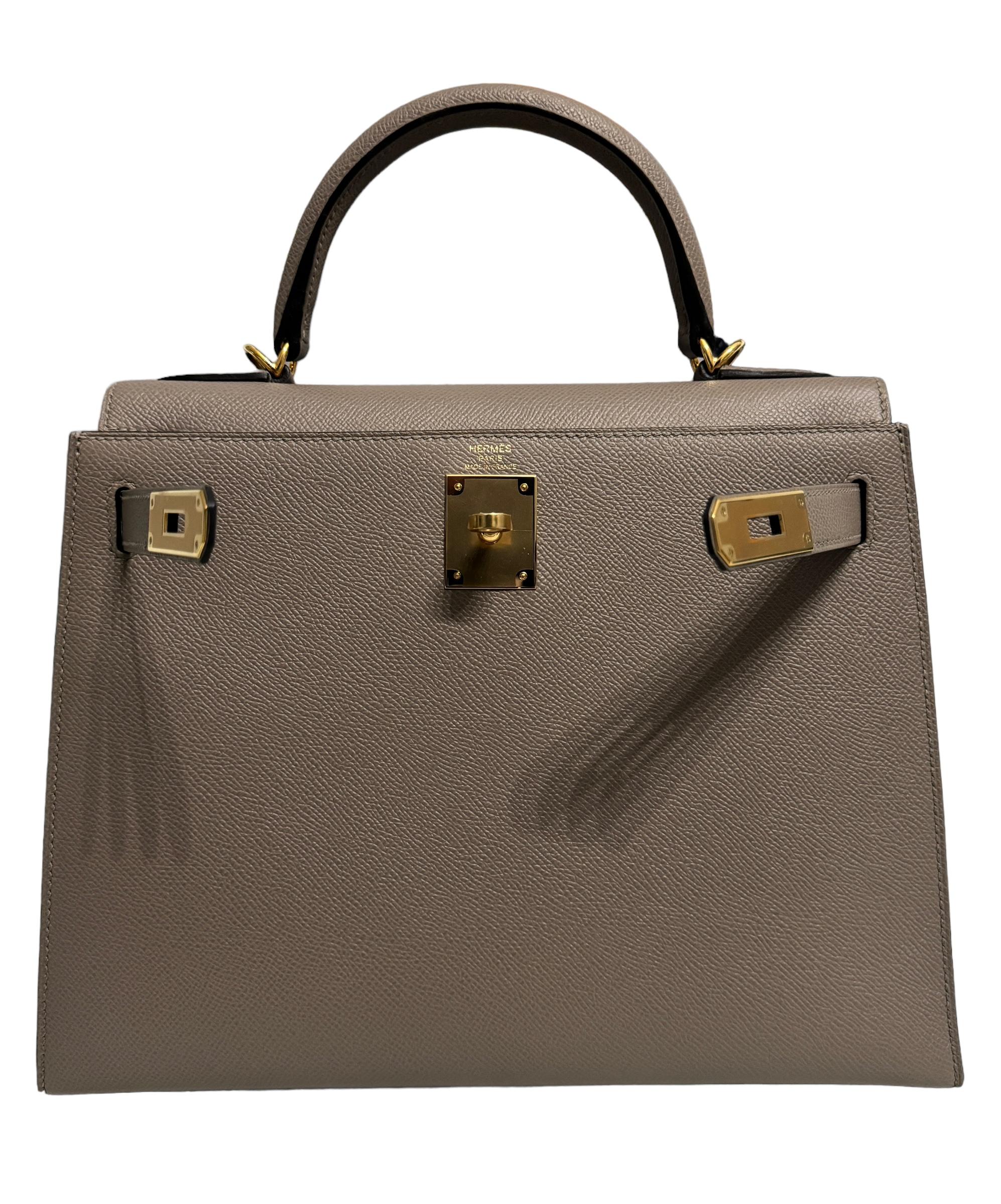 Absolutely Stunning Rare and Most Coveted As New GRAIL Hermes Kelly 28 Sellier Gris Asphalt Epsom Leather complimented by Gold Hardware. As New with Plastic on all hardware and feet. 2021 Z Stamp. 

Please see last photo. Bag may have very minor