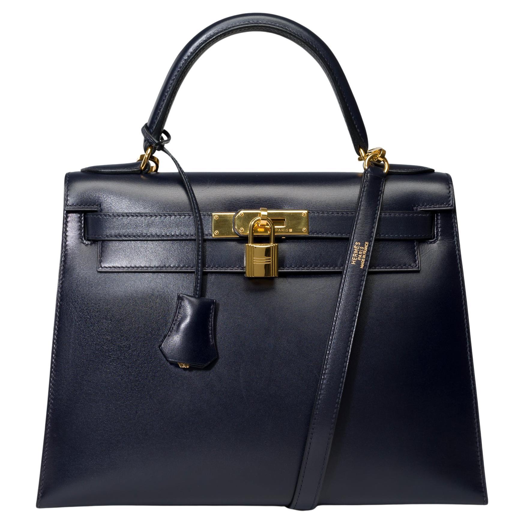 Beautiful​ ​Hermès​ ​Kelly​ ​28​ ​sellier​ ​handbag​ ​strap​ ​in​ ​Navy Blue ​box​ ​calfskin​ ​leather,​ ​gold​ ​plated​ ​metal​ ​hardware,​ ​removable​ ​navy blue​ ​box​ ​leather​ ​shoulder​ ​strap,​ ​navy blue​ ​box​ ​leather​ ​handle​ ​for​