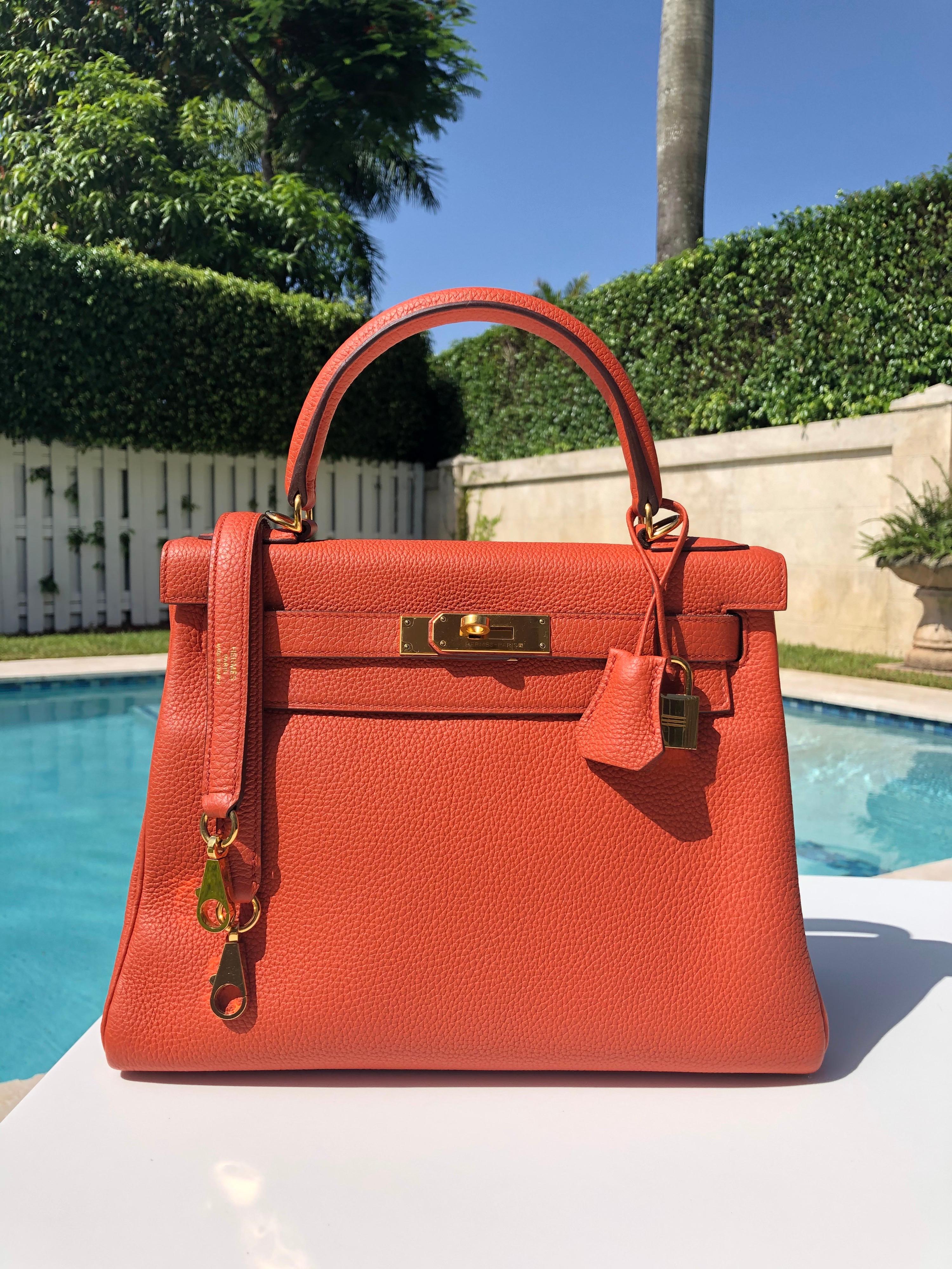 HERMES KELLY 28 Feu Fire Orange GOLD HARDWARE X STAMP 2016. Excellent Pristine Condition, plastic on plates except Hermès engraving plate. Perfect corners and excellent structure. No odors or stains.

Shop with confidence from Lux Addicts.