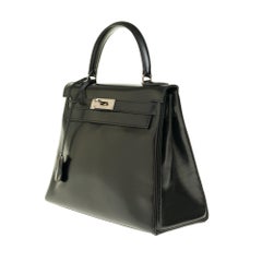 Hermès Kelly 28cm shoulder bag with strap in black calfskin and silver hardware