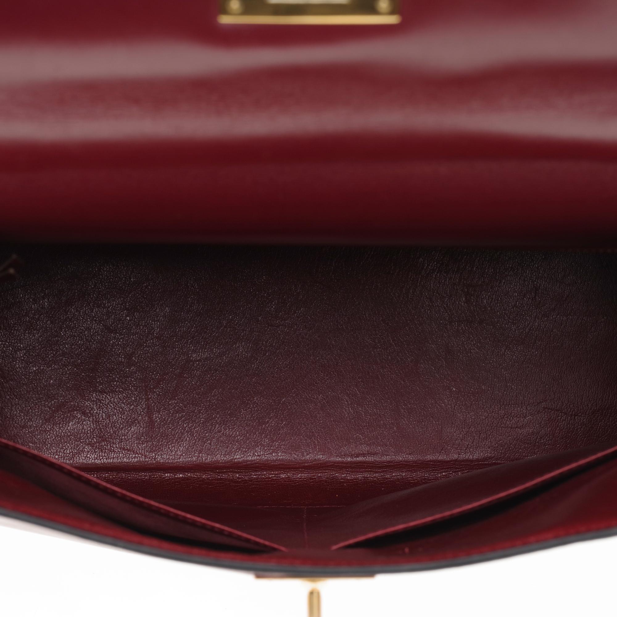 Women's Hermès Kelly 28cm retourné handbag in burgundy box calfskin with Gold hardware