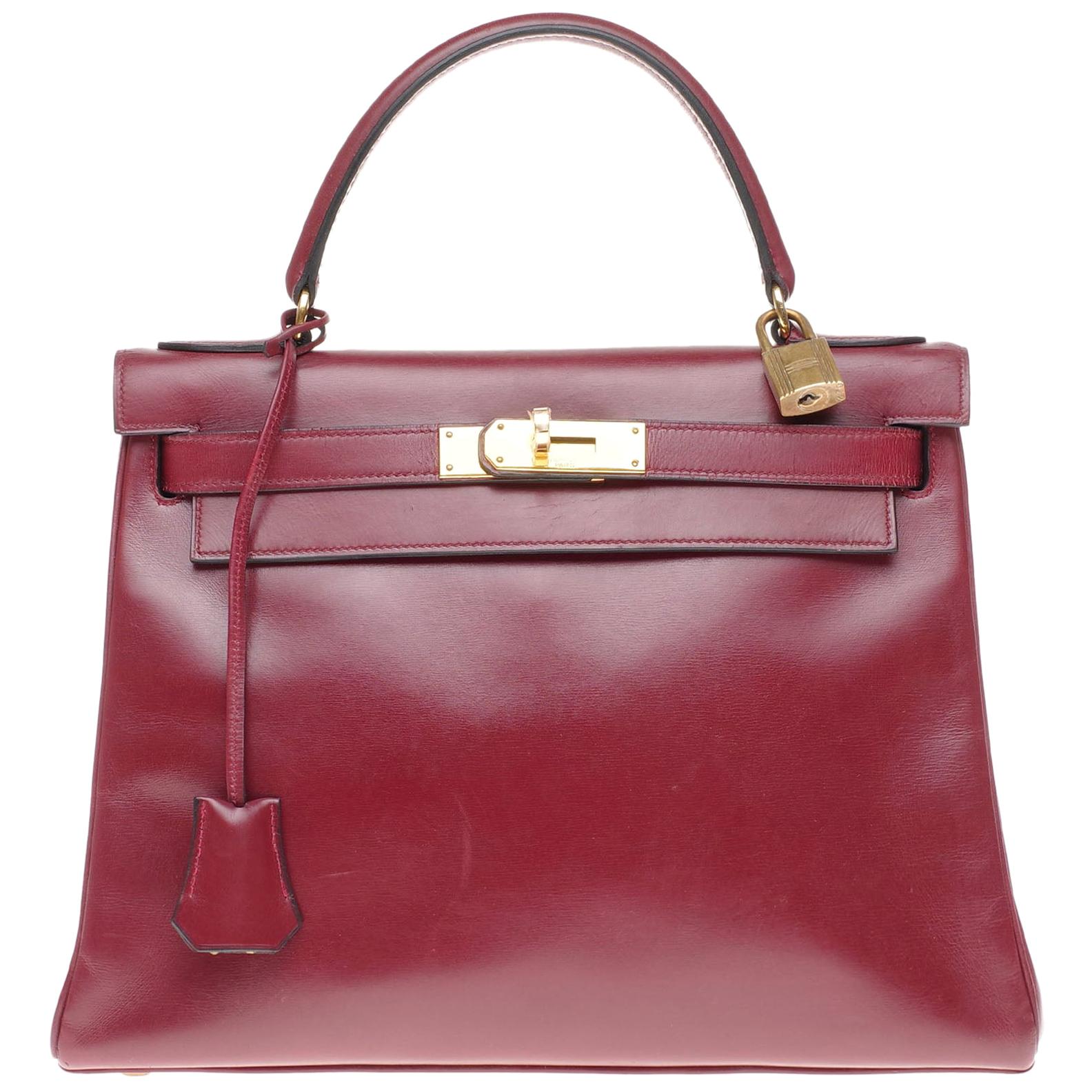 Hermès Kelly 28cm retourné handbag in burgundy box calfskin with Gold hardware