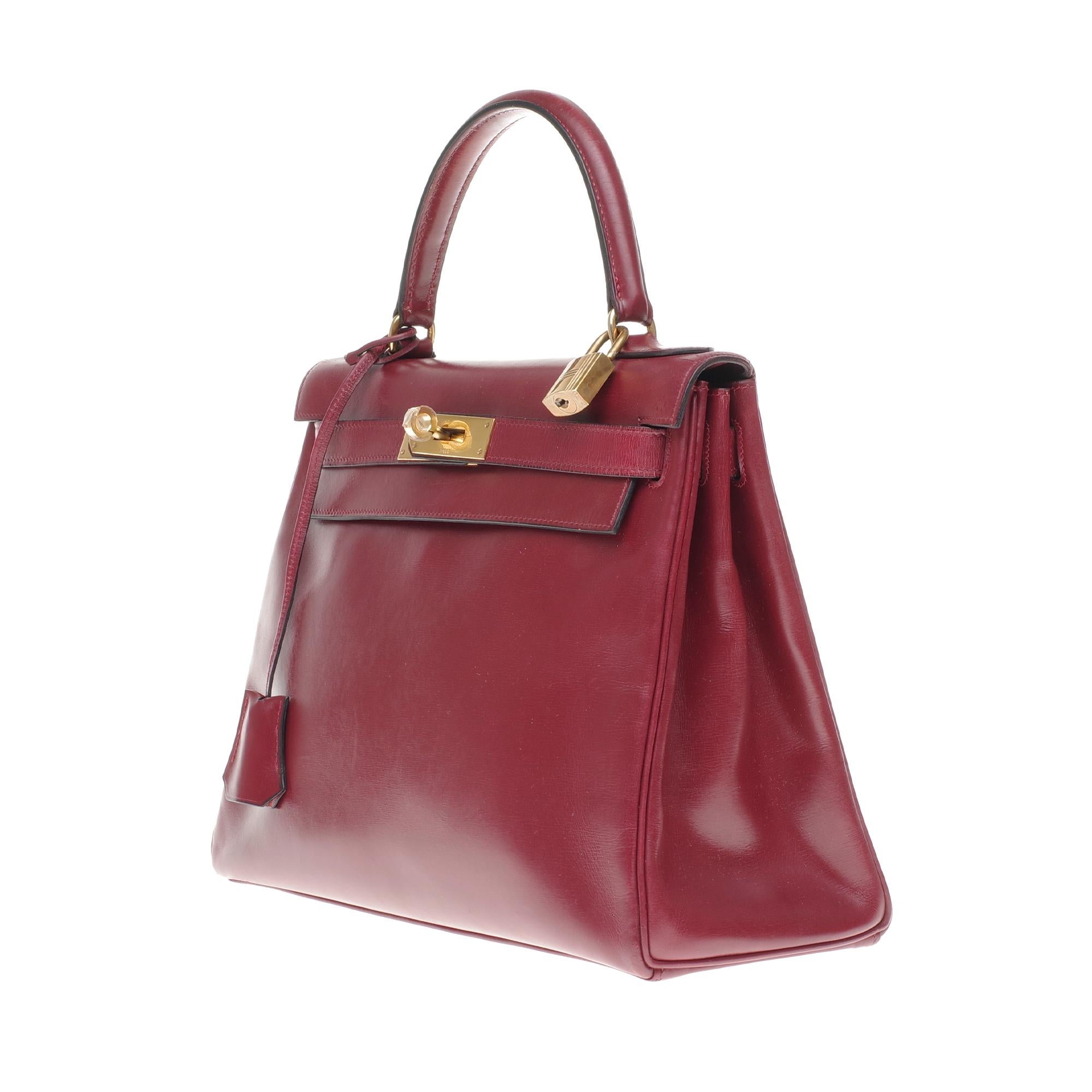 Brown Hermès Kelly 28cm retourné handbag in burgundy calfskin Gold hardware