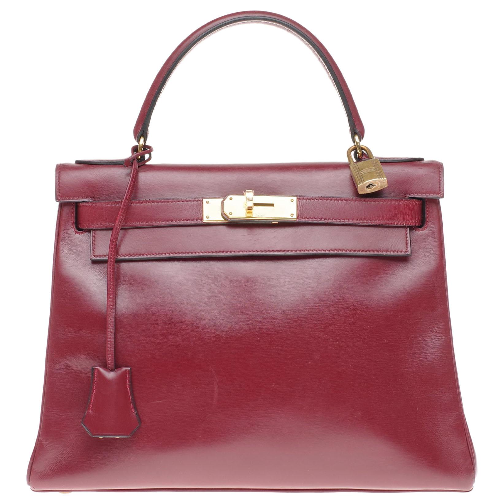 Hermès Kelly 28cm retourné handbag in burgundy calfskin Gold hardware
