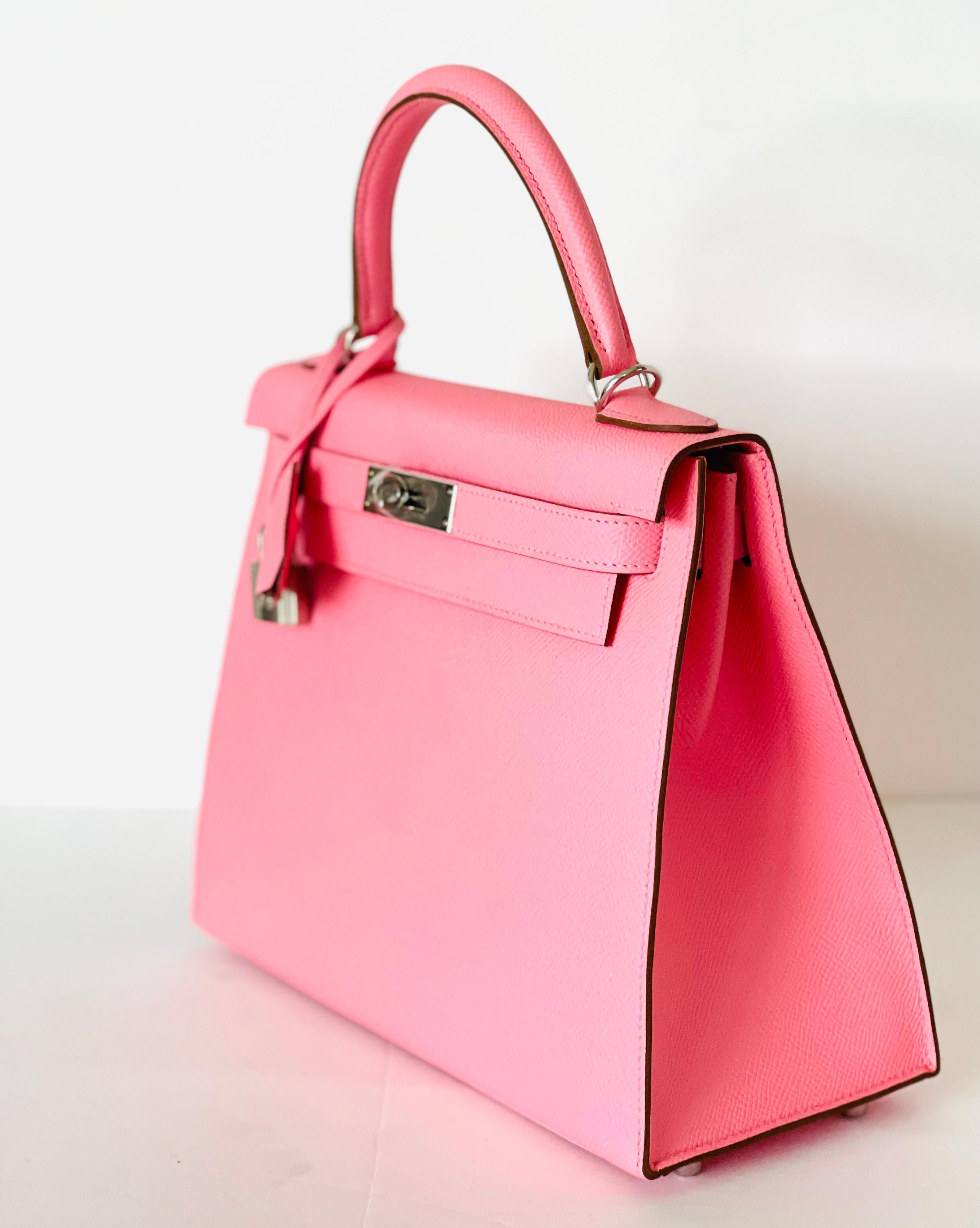 Hermès 
Kelly 28 cm 
Rose Confetti, retired color that has been brought back for a limited time
Epsom Leather, Sellier Style
Tonal topstich 
Palladium Hardware
Top handle with removable shoulder strap 




New, never worn
Storefresh with plastic on