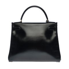 Hermès Kelly 28cm shoulder bag with strap in black calfskin and gold hardware