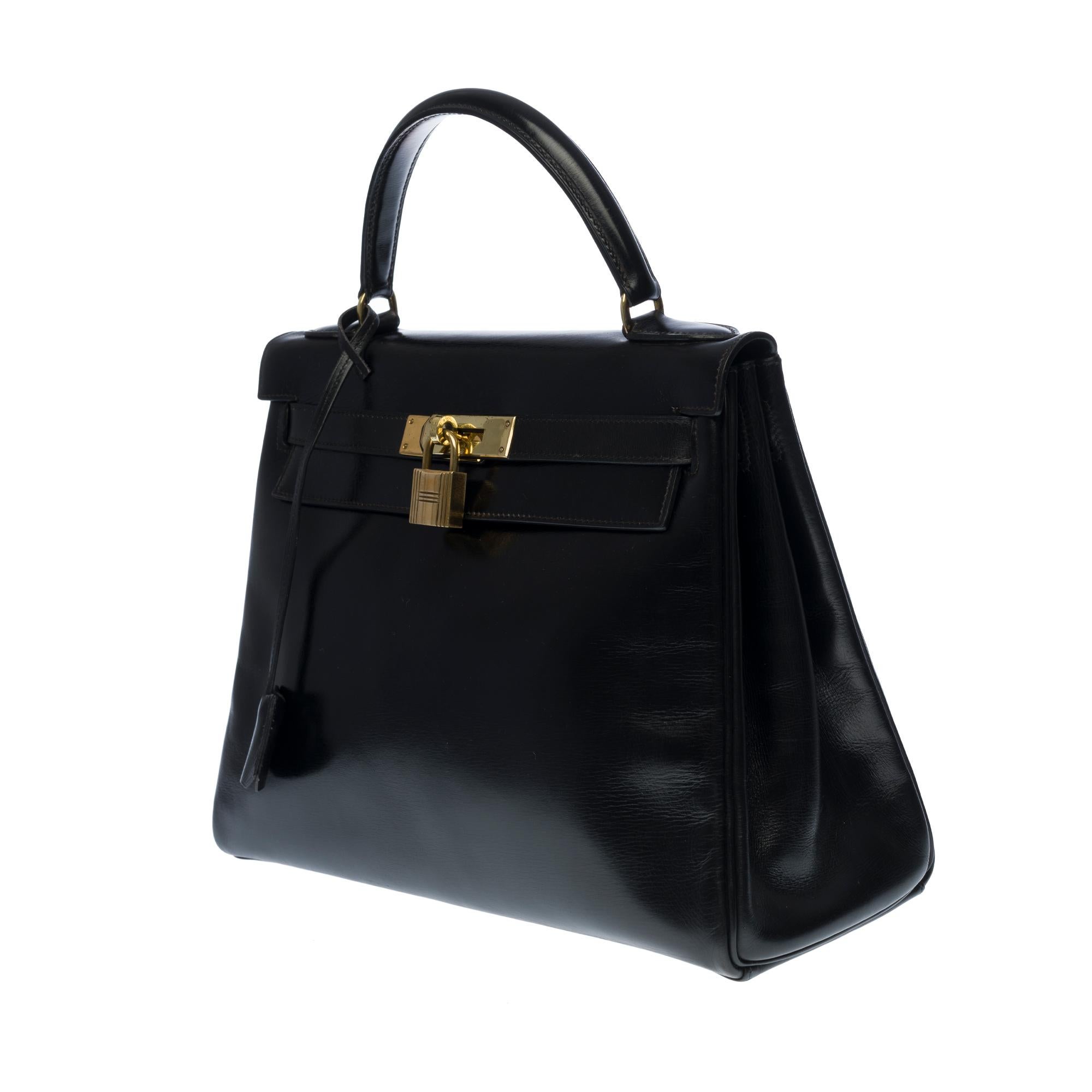 Black Hermès Kelly 28cm shoulder bag with strap in black calfskin and gold hardware