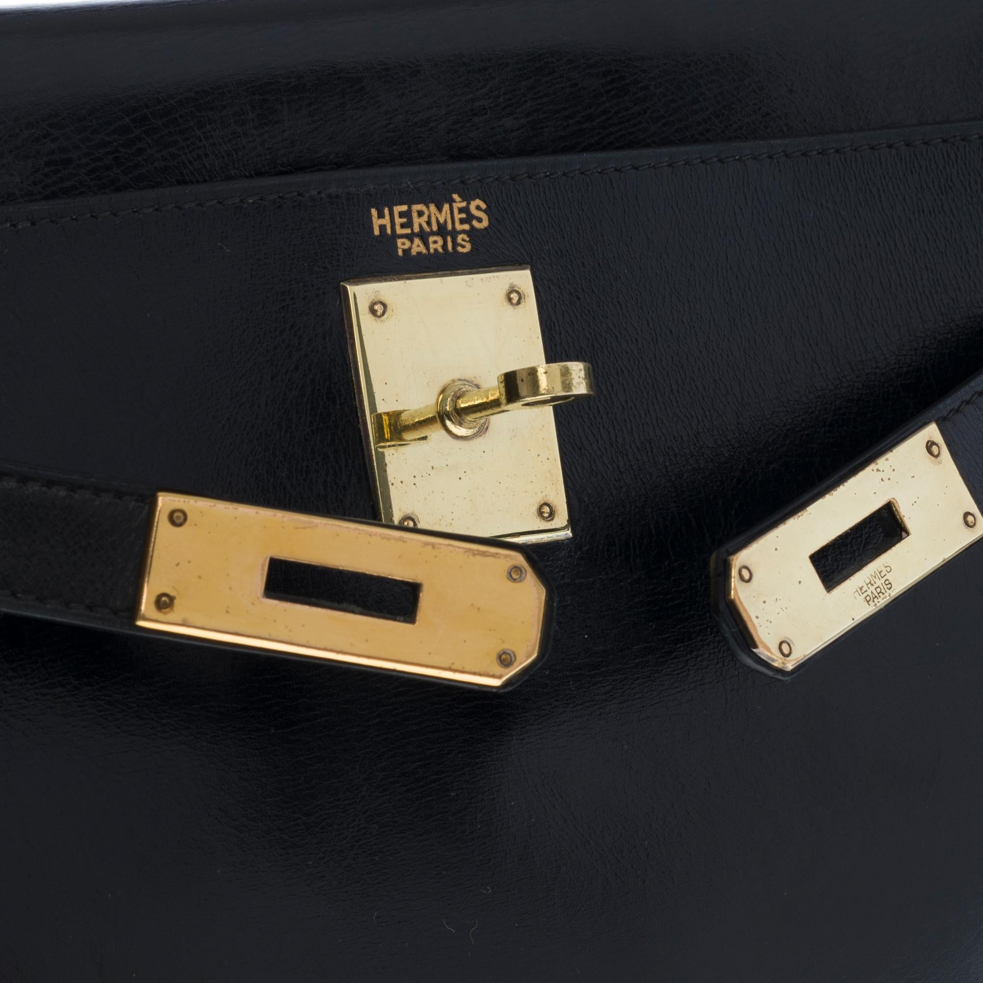 Women's Hermès Kelly 28cm shoulder bag with strap in black calfskin and gold hardware