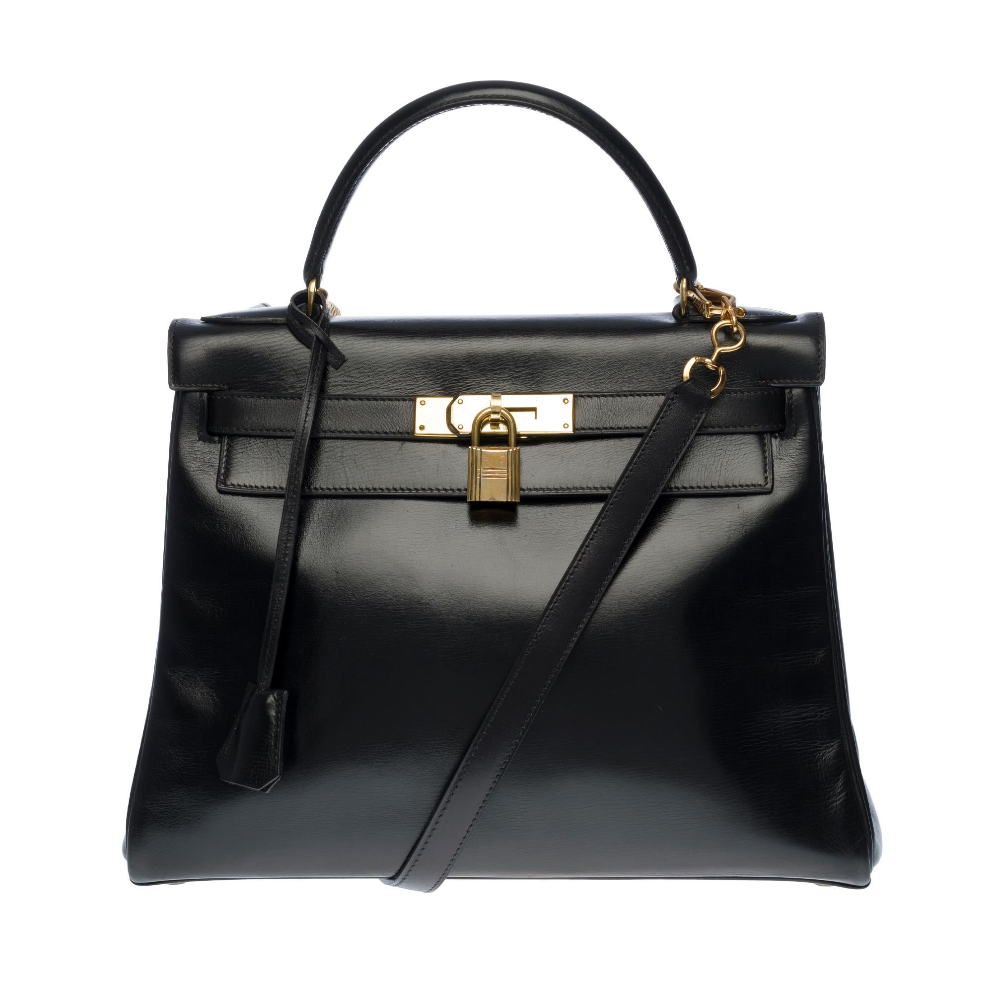 Hermès Kelly 28cm shoulder bag with strap in black calfskin and gold hardware