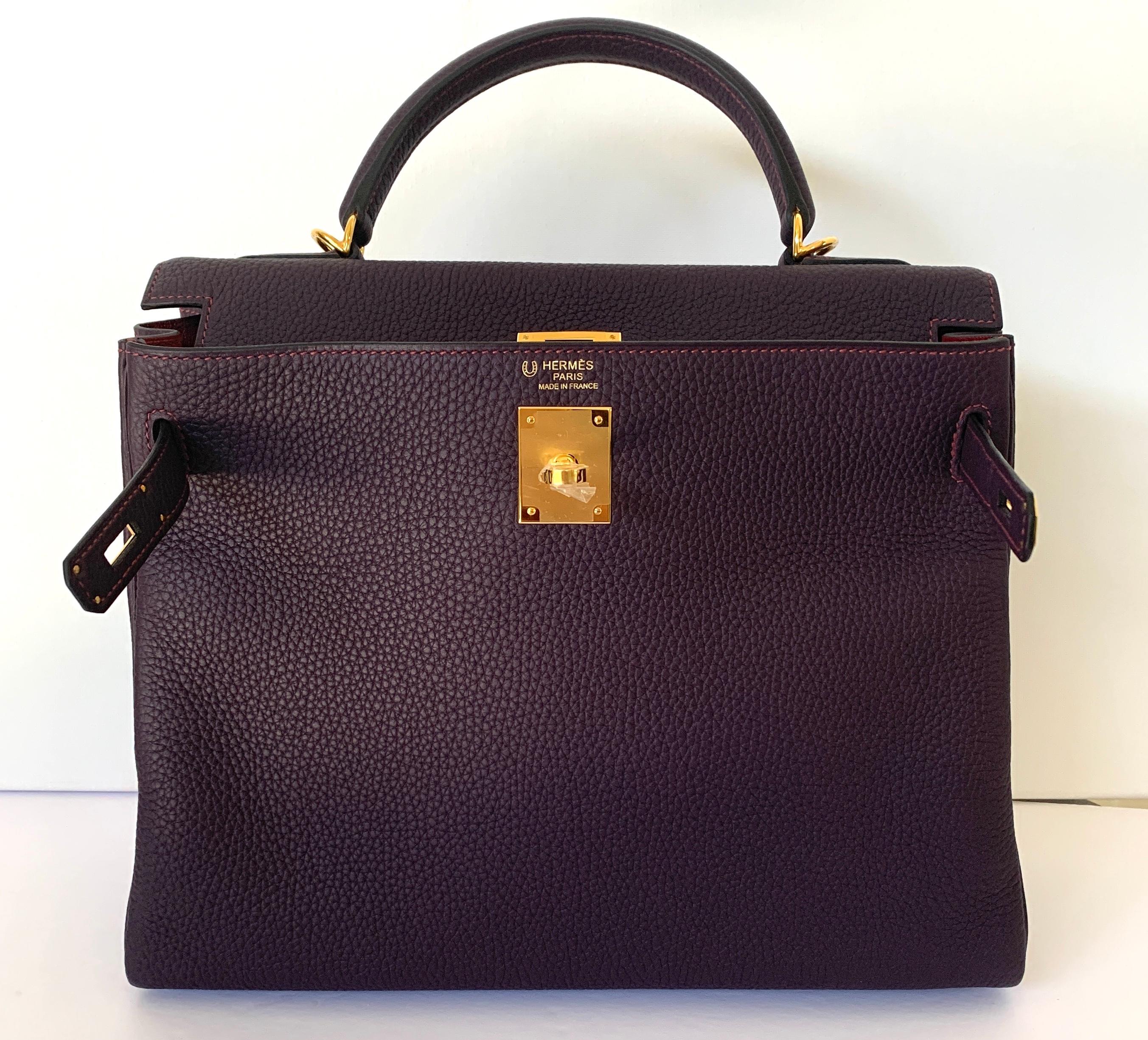 Hermes Special Order Kelly Bag
32Cm
Horseshoe stamp
2020 Y
Togo Leather
Raisin reintroduced color, always a favorite
A beautiful jeweltone! The camera does not capture how gorgeous and rich this color is
Set off with contrast pink topstitching, pink