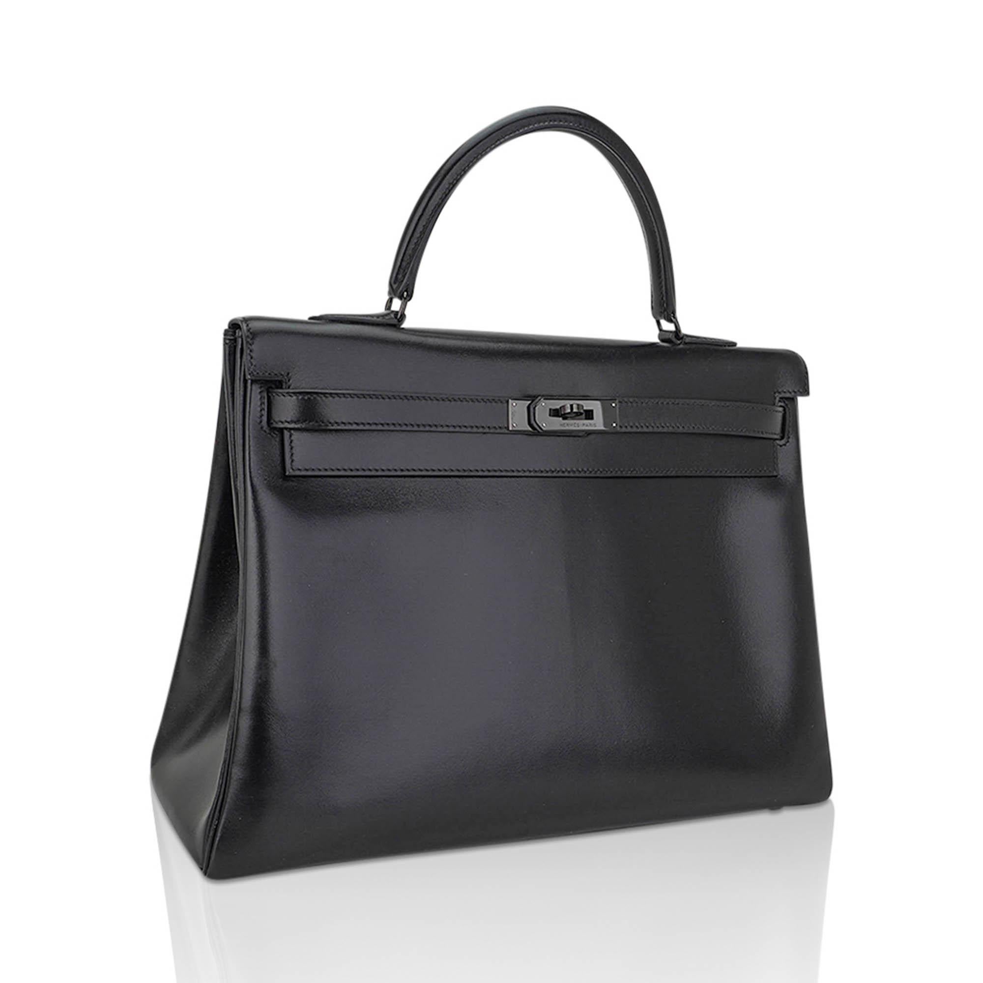 Mightychic offers a rare limited edition Hermes Kelly 32 So Black bag is featured in Heritage Box leather.
The collection was the final bow of Jean-Paul- Gaultiers' genius as creative director at Hermes before he left.
This exceptional bag is nearly