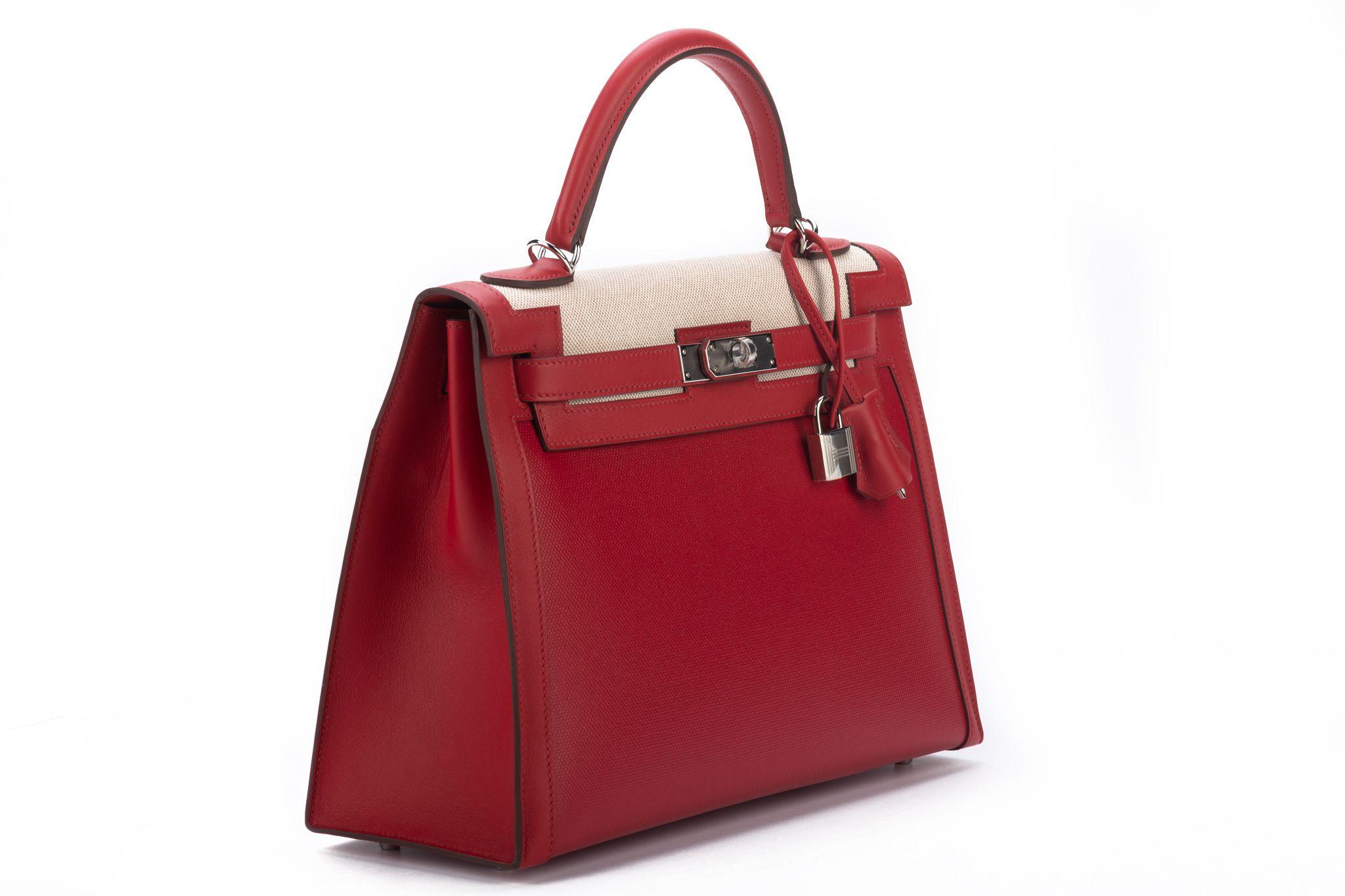 Hermes one of a kind currently for sale Kelly II sellier Berlin, ecru toile and rouge pigment swift leather. Palladium Hardware. Specially coated red pigment toile, very durable and lightweight. Letter Z for 2021. Brand new in box. Comes with strap,