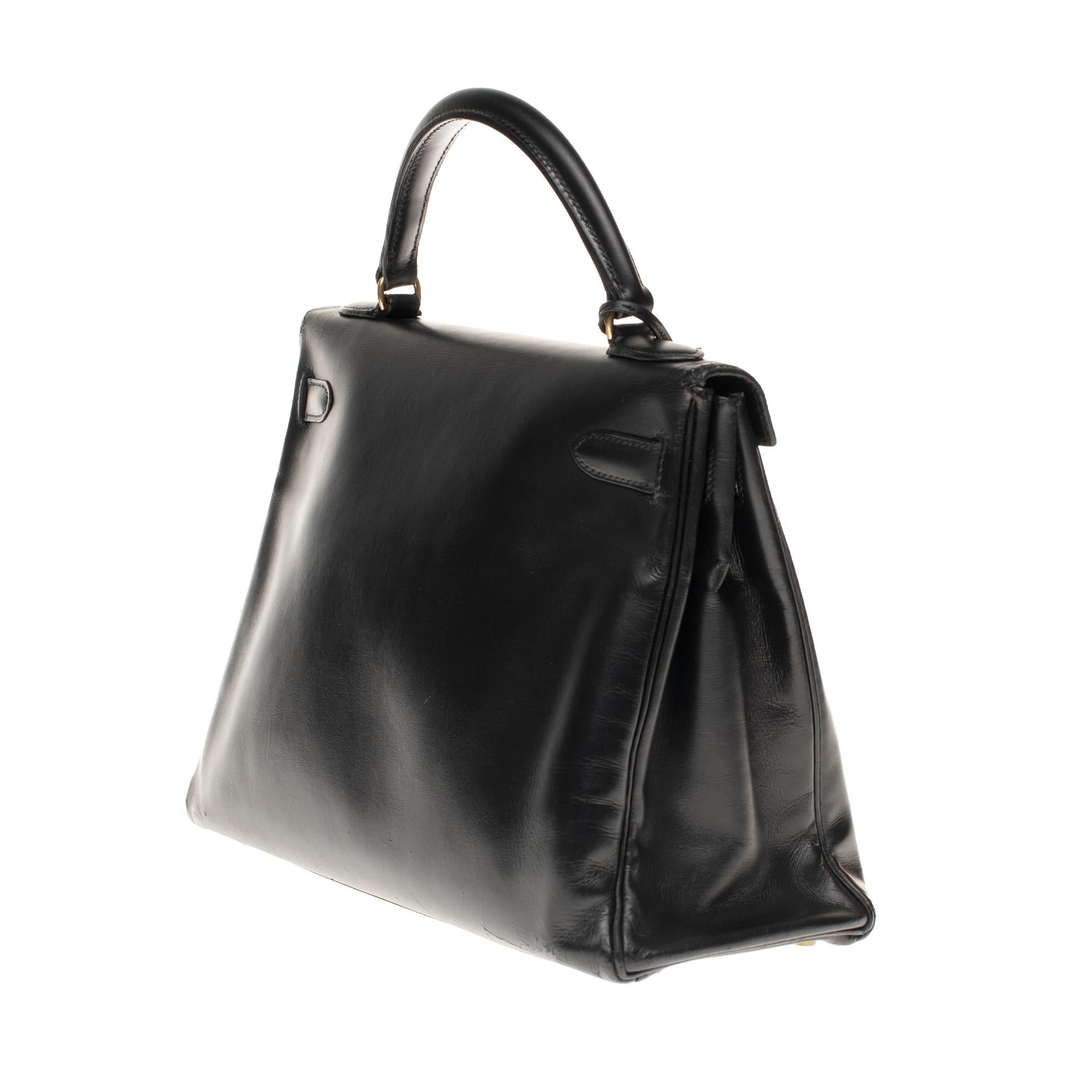 Black Hermès Kelly 32 cm strap shoulder bag in black calfskin box and gold hardware