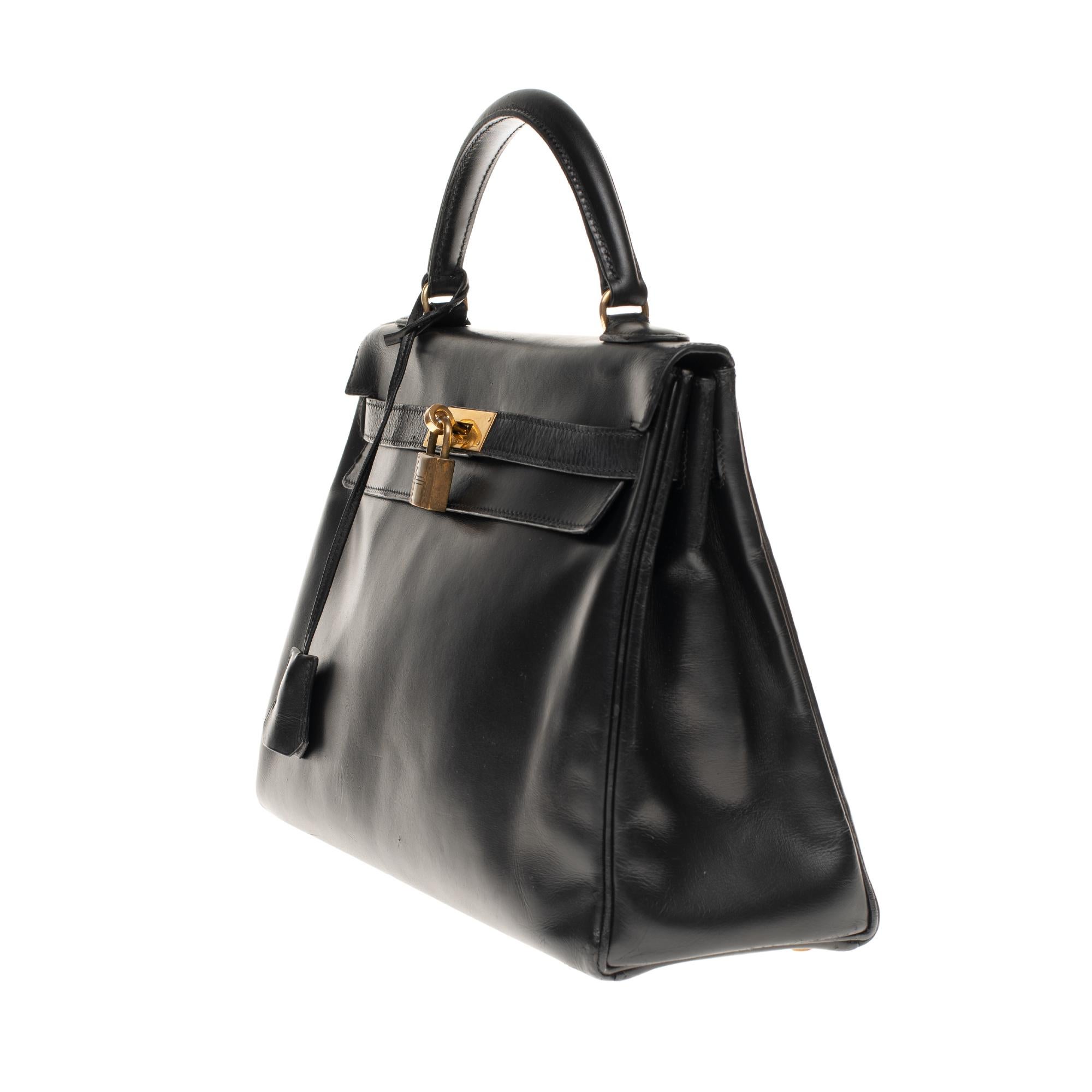 Hermès Kelly 32 cm strap shoulder bag in black calfskin box and gold hardware In Good Condition In Paris, IDF